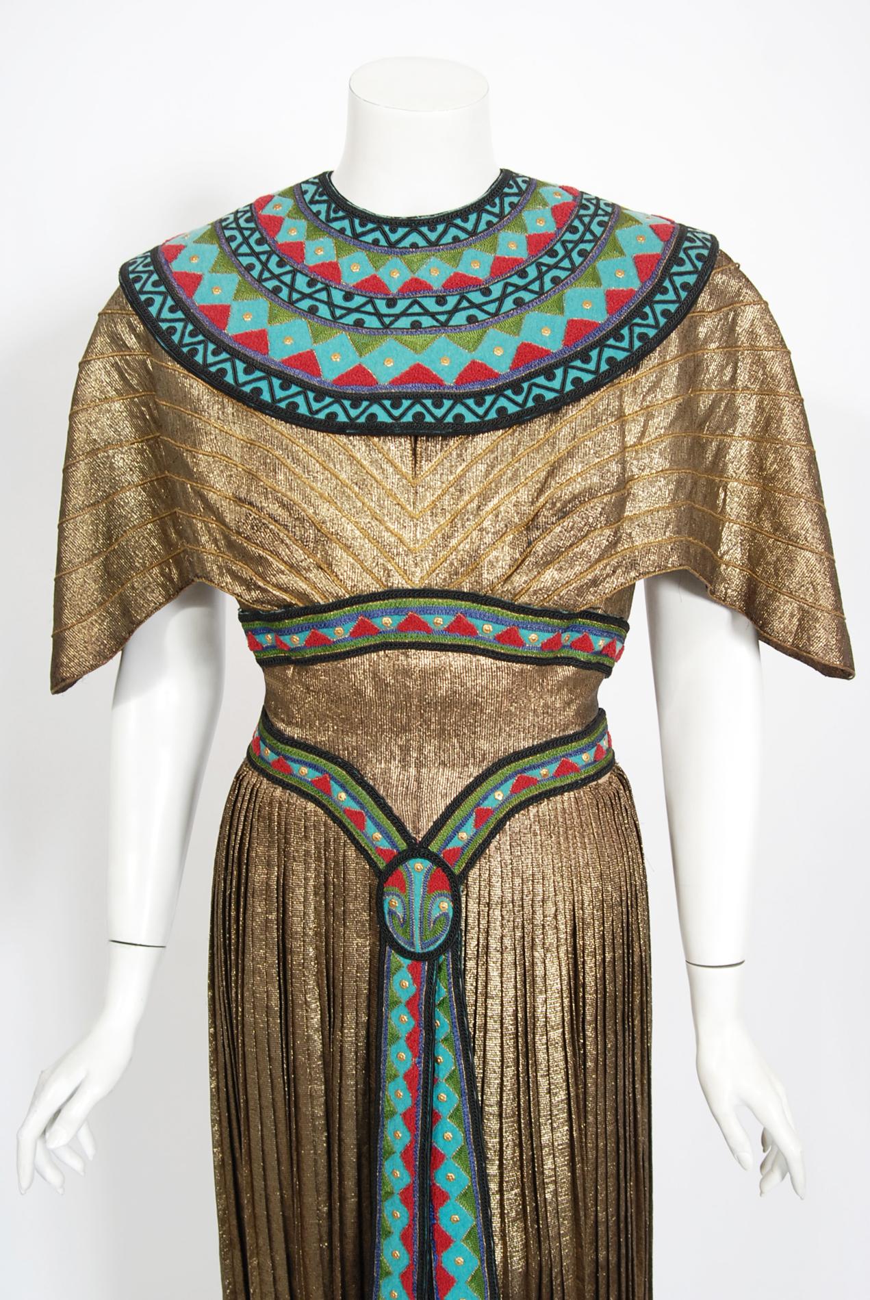 A breathtaking and truly one-of-a-kind metallic gold pleated lamé Egyptian novelty dress designed by Helen Rose for the MGM 1951 film 