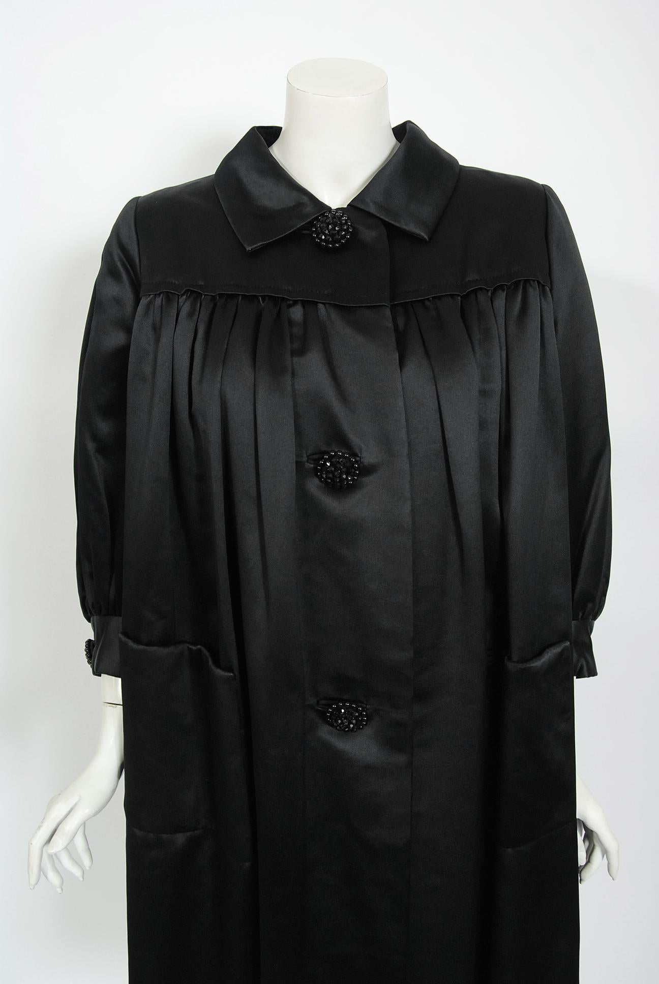 black pleated coat