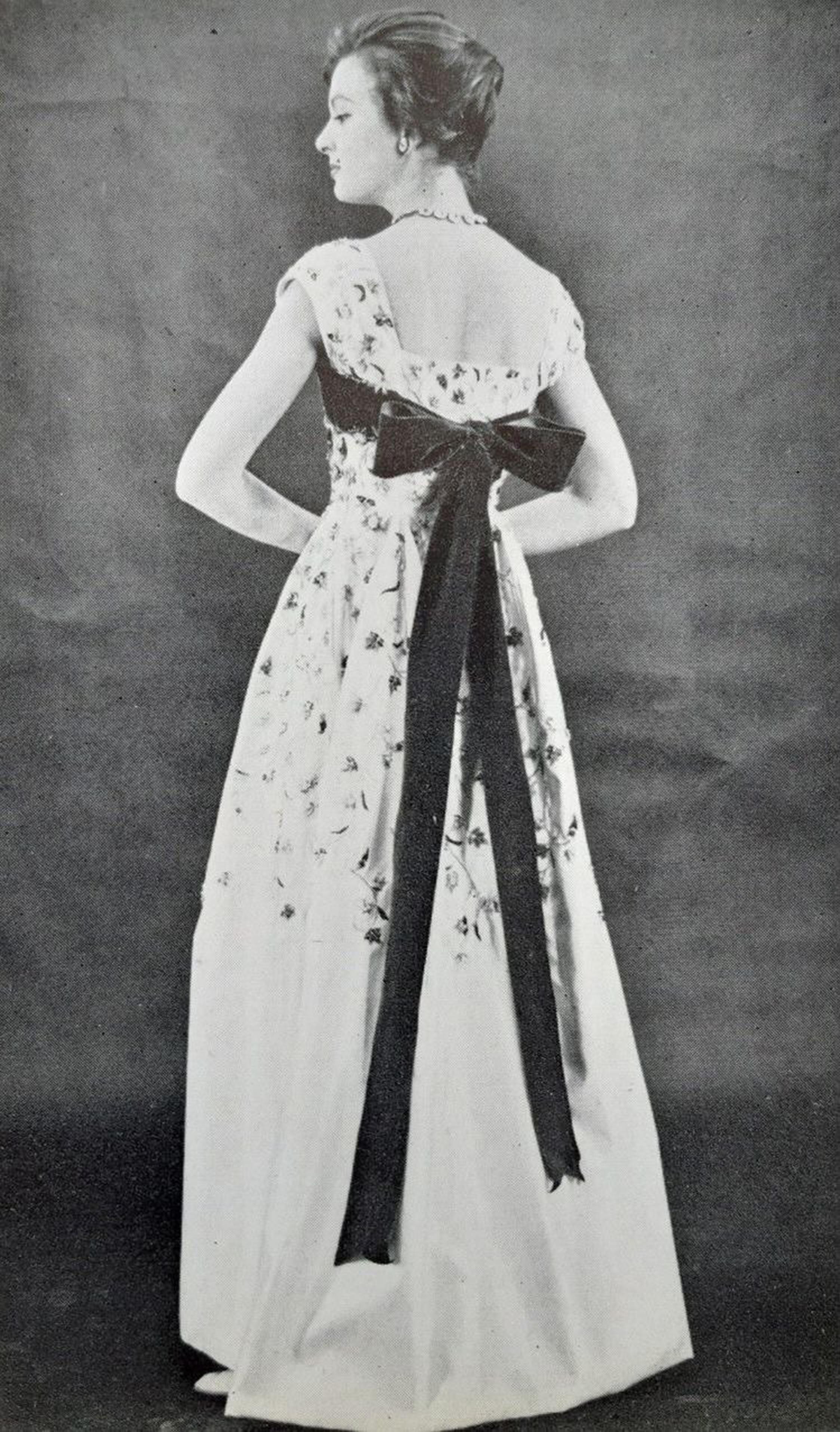 A magnificent, well-documented Jacques Griffe haute couture heavily embroidered and beaded ivory satin gown dating back to his 1956 fall-winter collection. From 1936 to 1939 Jacques Griffe worked with Madeleine Vionnet as a cutter, before launching