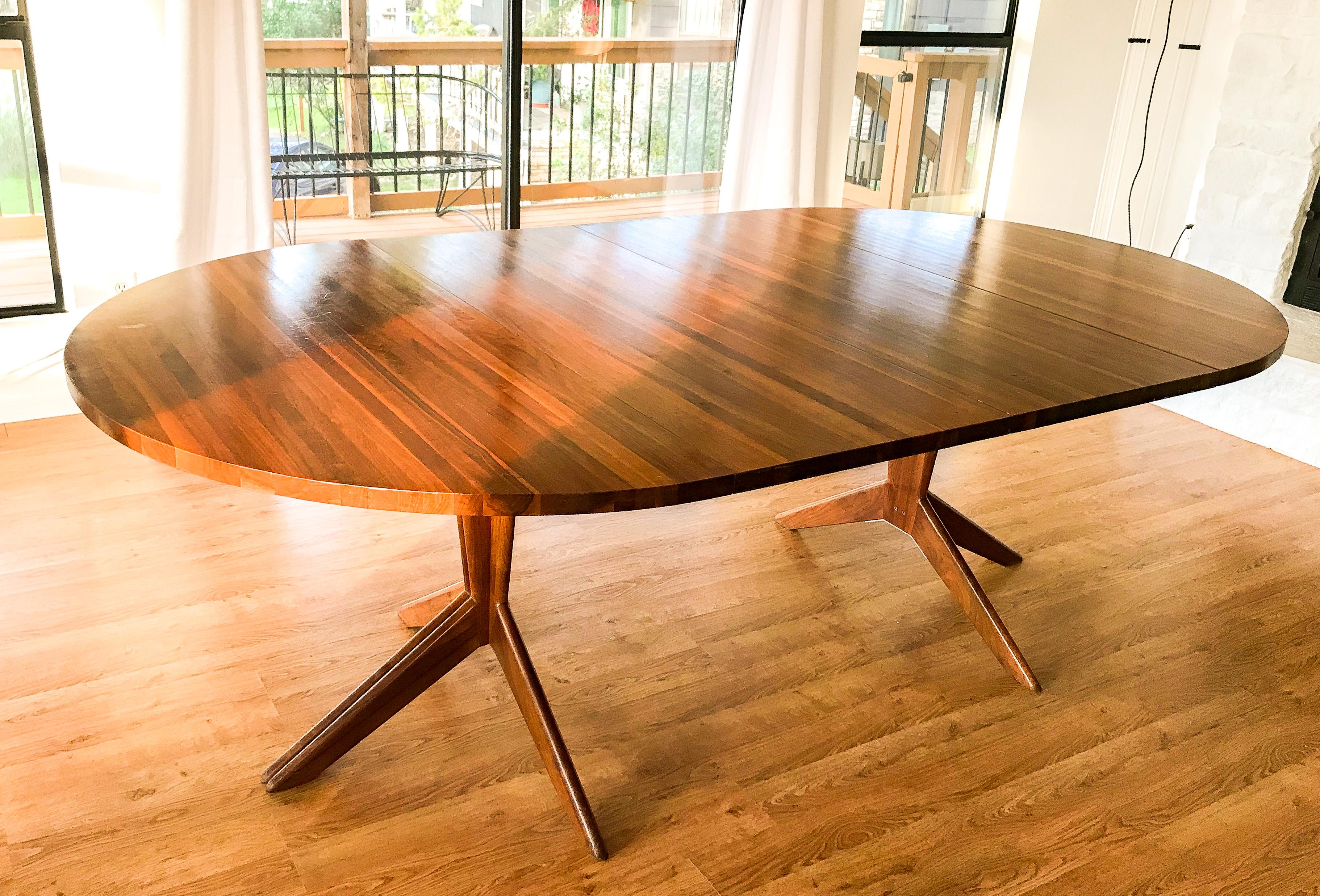 This vintage 1956 solid walnut pedestal extension dining table by Mel Smillow is in overall great condition. Shows wear consistent with age and use. Table base splits and expands to accommodate 1-3 leaves.
circa 1950s. USA.
Dimensions:
48