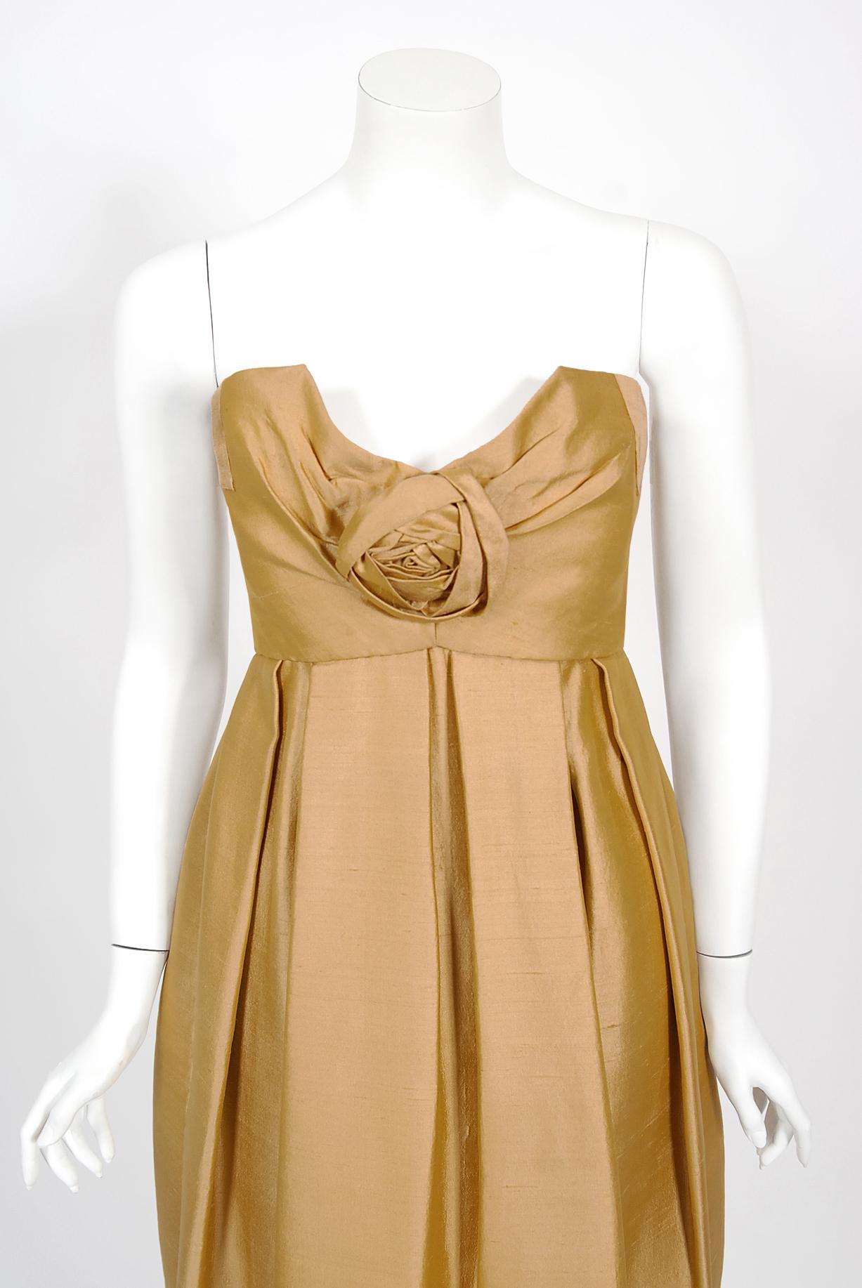 We are pleased to offer this important and incredibly rare golden dupioni silk party dress from Yves Saint Laurent was head designer for Christian Dior's fall-winter 1958 collection. Yves Saint Laurent continued the Dior tradition of elegant
