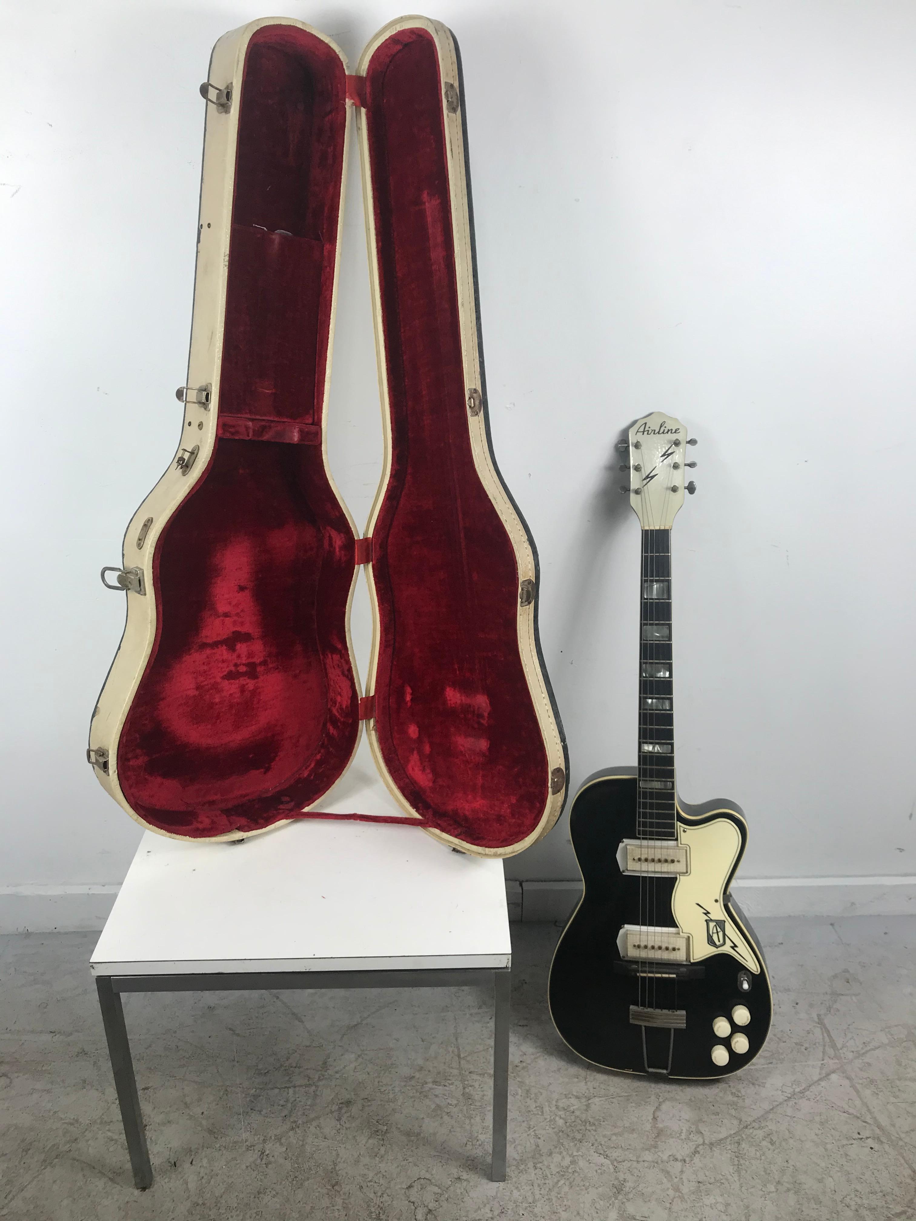 Vintage Airline electric guitar, nice original condition, minor peeling paint loss to backside//, Great action, intonation, Art Deco Modernist design, plays and sounds amazing, retains original case,

Airline Series
Airline Guitars were made in