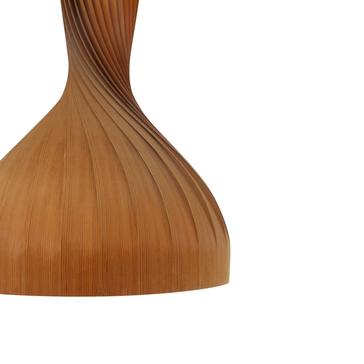 Vintage pendant produced by AB Markaryd, Sweden, design Hans-Agne Jakobsson:

Whether these lamps are turned on or off, they are real eye catchers in any interior, beautifully created with many layers of pinewood bent into a “swirl” that widens