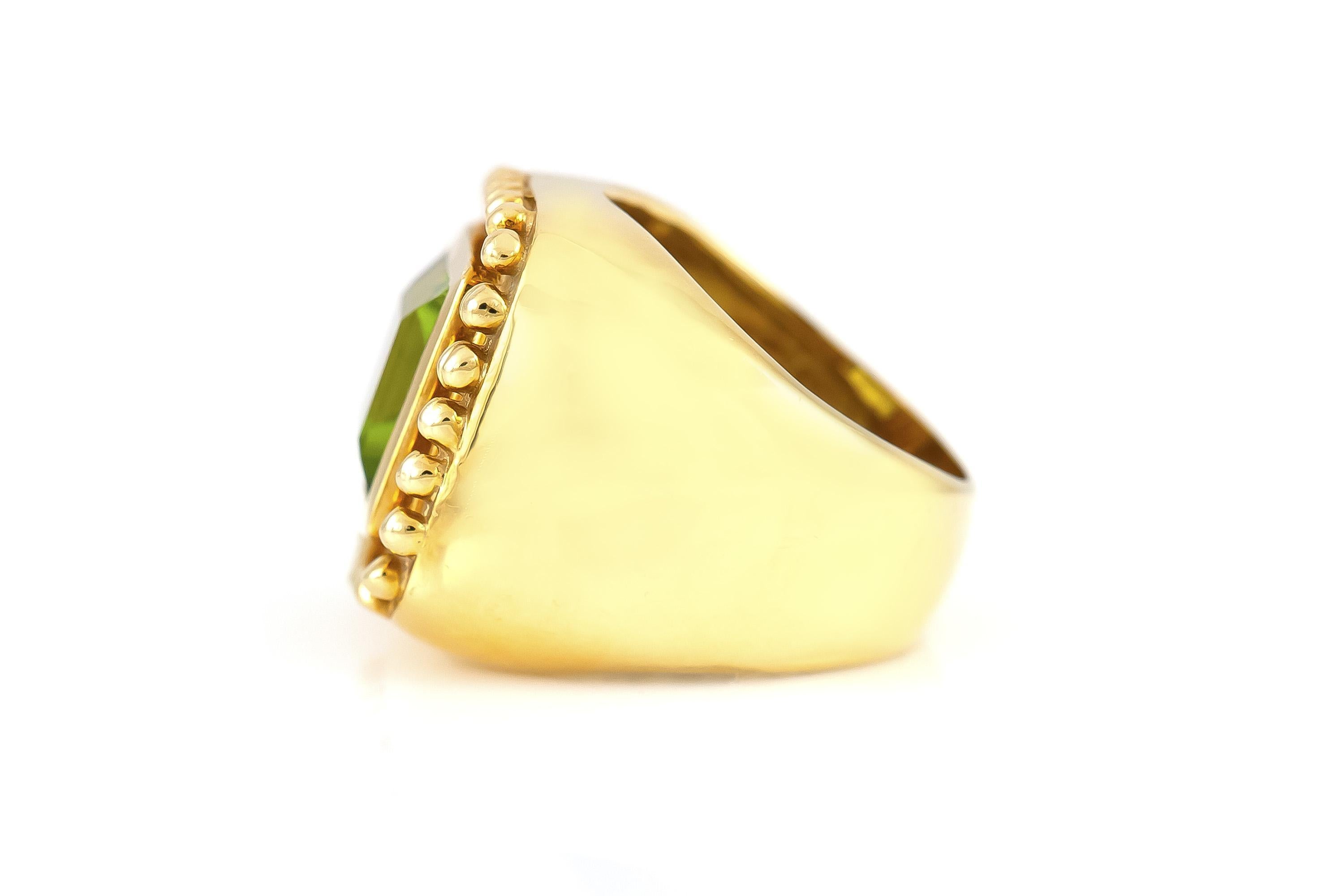 Finely crafted in 18k yellow gold with a Square Step cut Peridot weighing approximately 10.00 carats.
Circa 1960s
Size 6 1/2, resizable