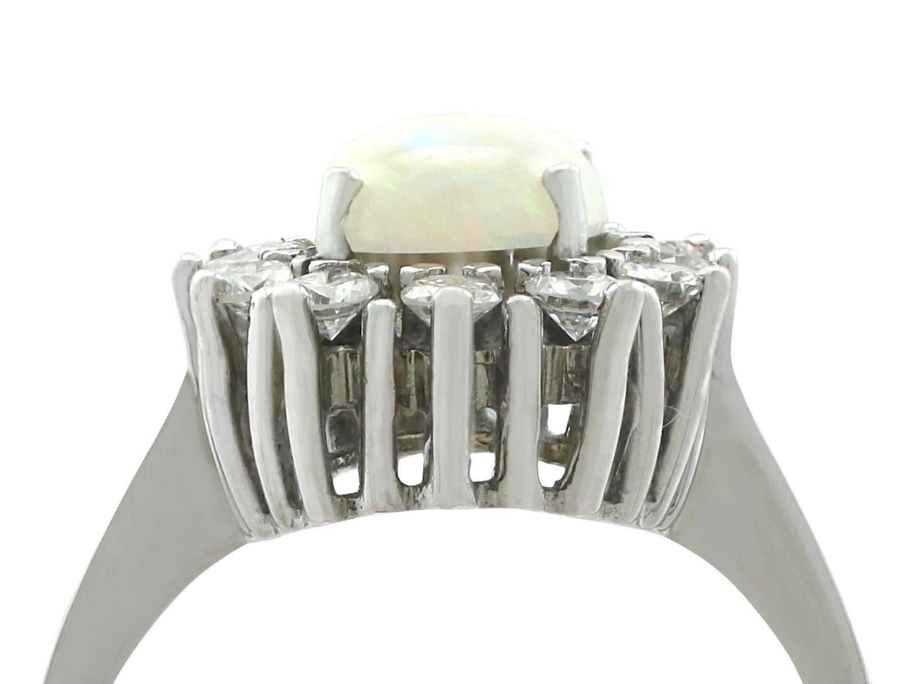 An impressive vintage 1.26 carat opal and 0.60 carat diamond, 14k white gold cluster ring; part of our diverse gemstone jewellery collections. 

This fine and impressive vintage opal cluster ring has been crafted in 14k white gold.

The pierced