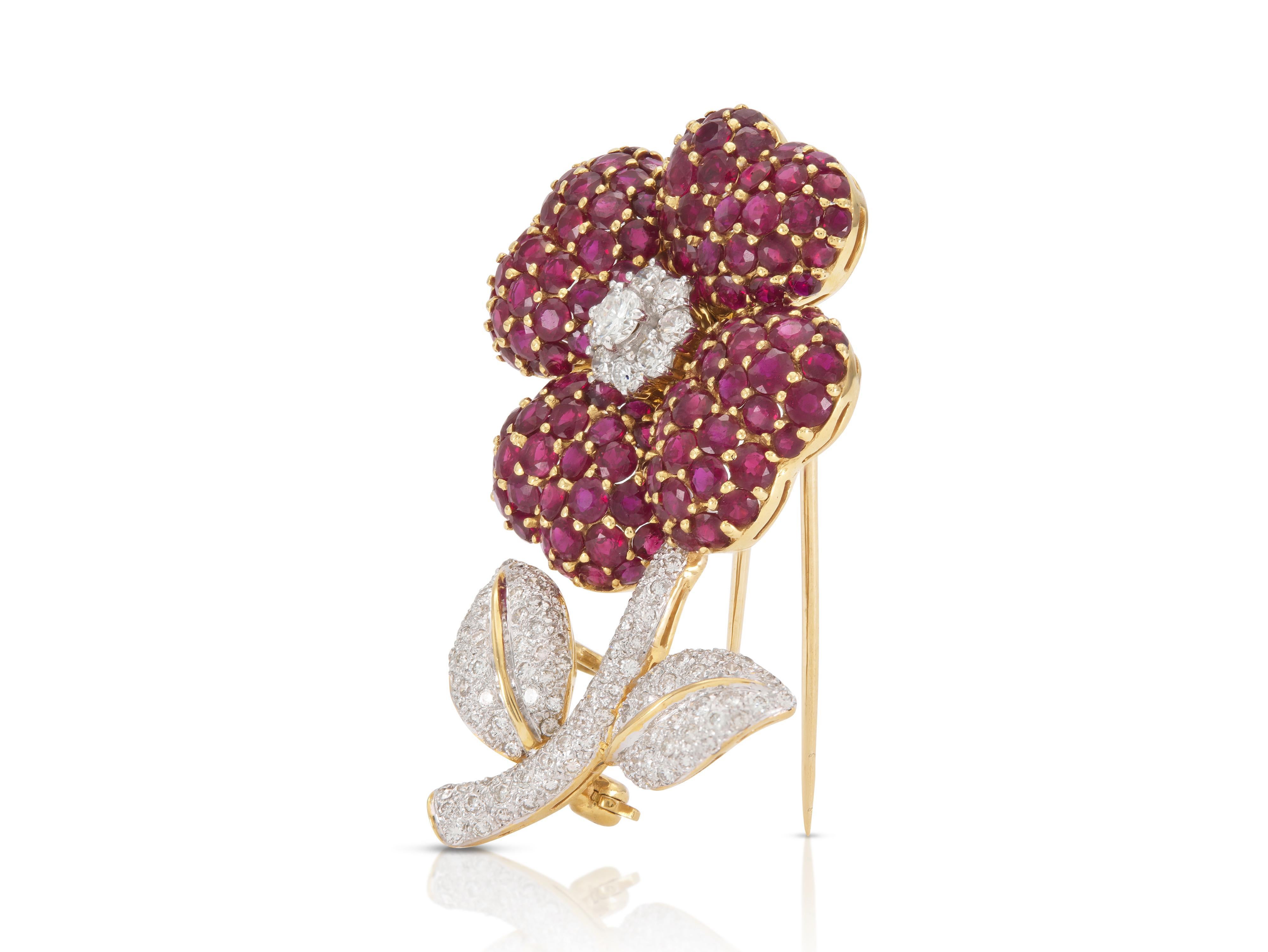 Finely crafted in 18k yellow and white gold with Round cut Rubies weighing approximately a total of 12.80 carats and Round Brilliant cut Diamonds weighing approximately a total of 1.70 carats
Circa 1960s
1 7/8 x 1 1/8 inch
