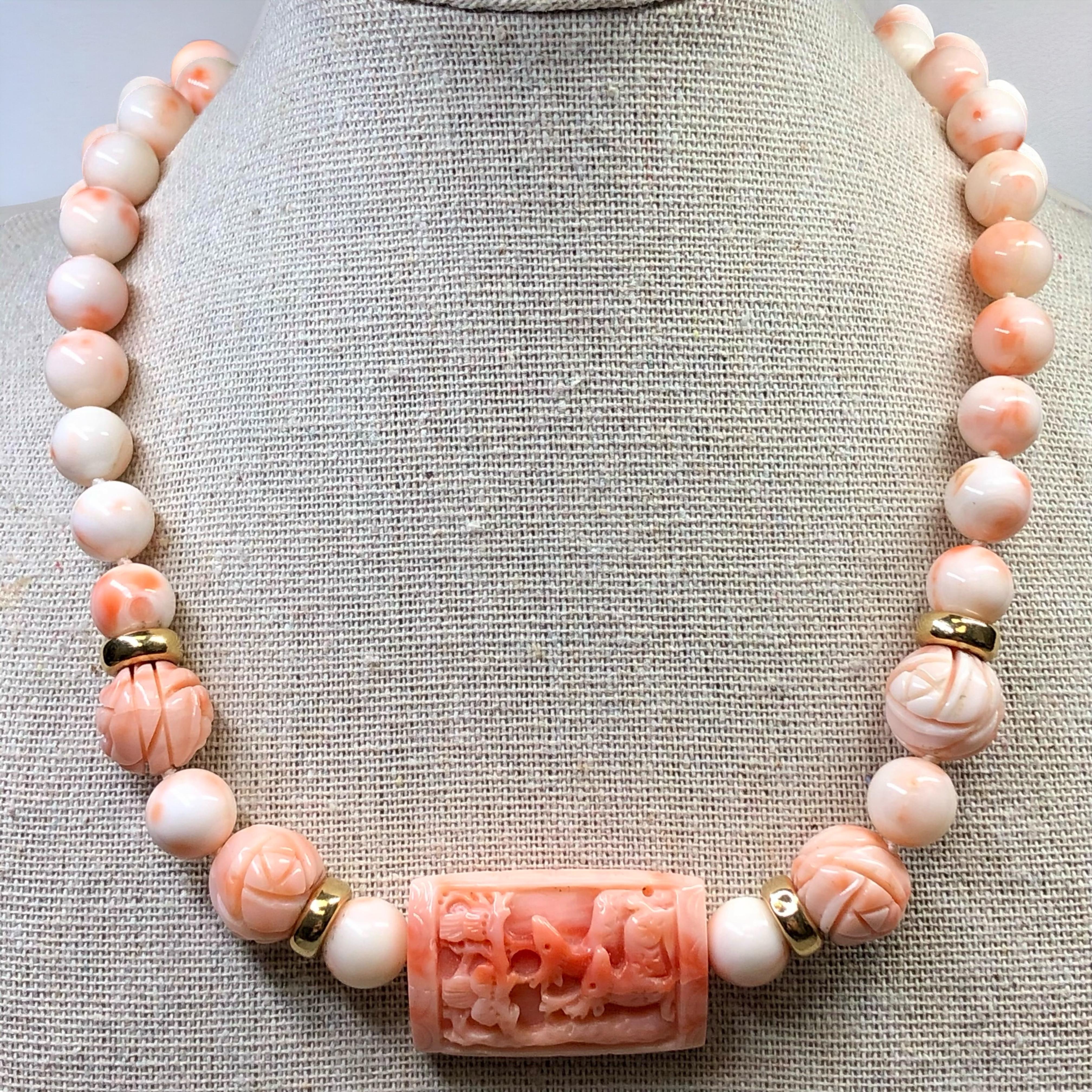 
A vintage necklace circa the 1960’s done in natural pink coral spheres, both polished and carved which are separated by 14K yellow gold rondelles. This lovely piece is centered by an intricately detailed double-sided coral carving. A lovely example