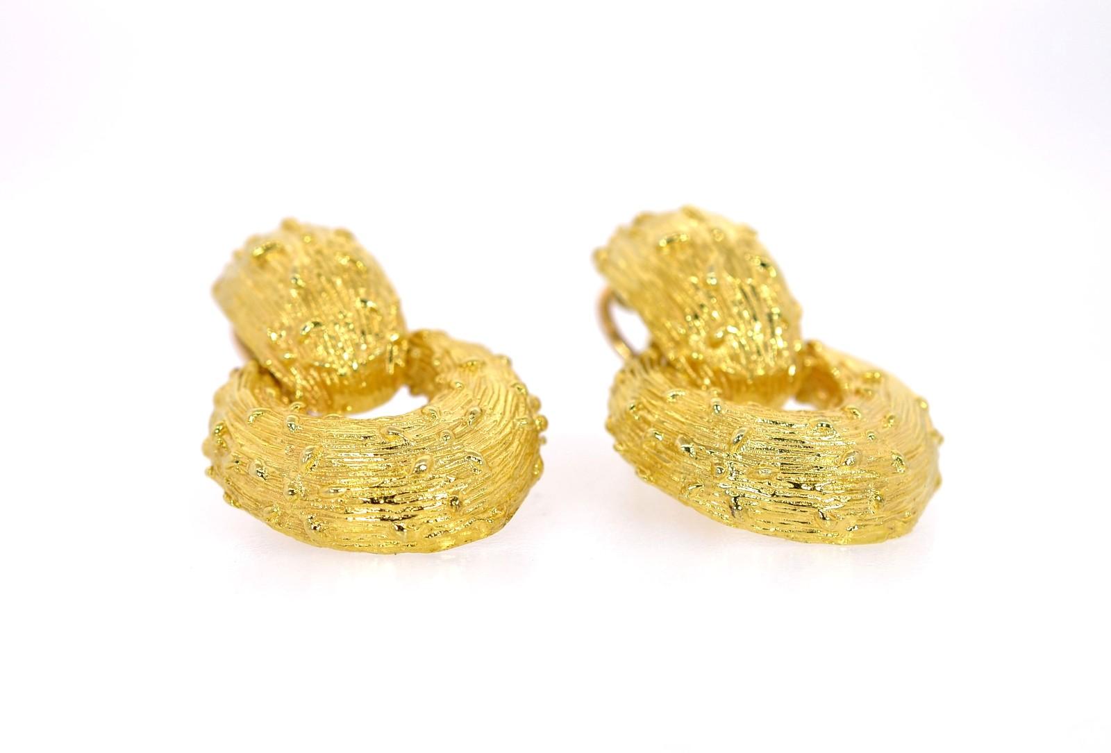 Crafted of 14K yellow gold, these 1960s-era earrings are designed as 