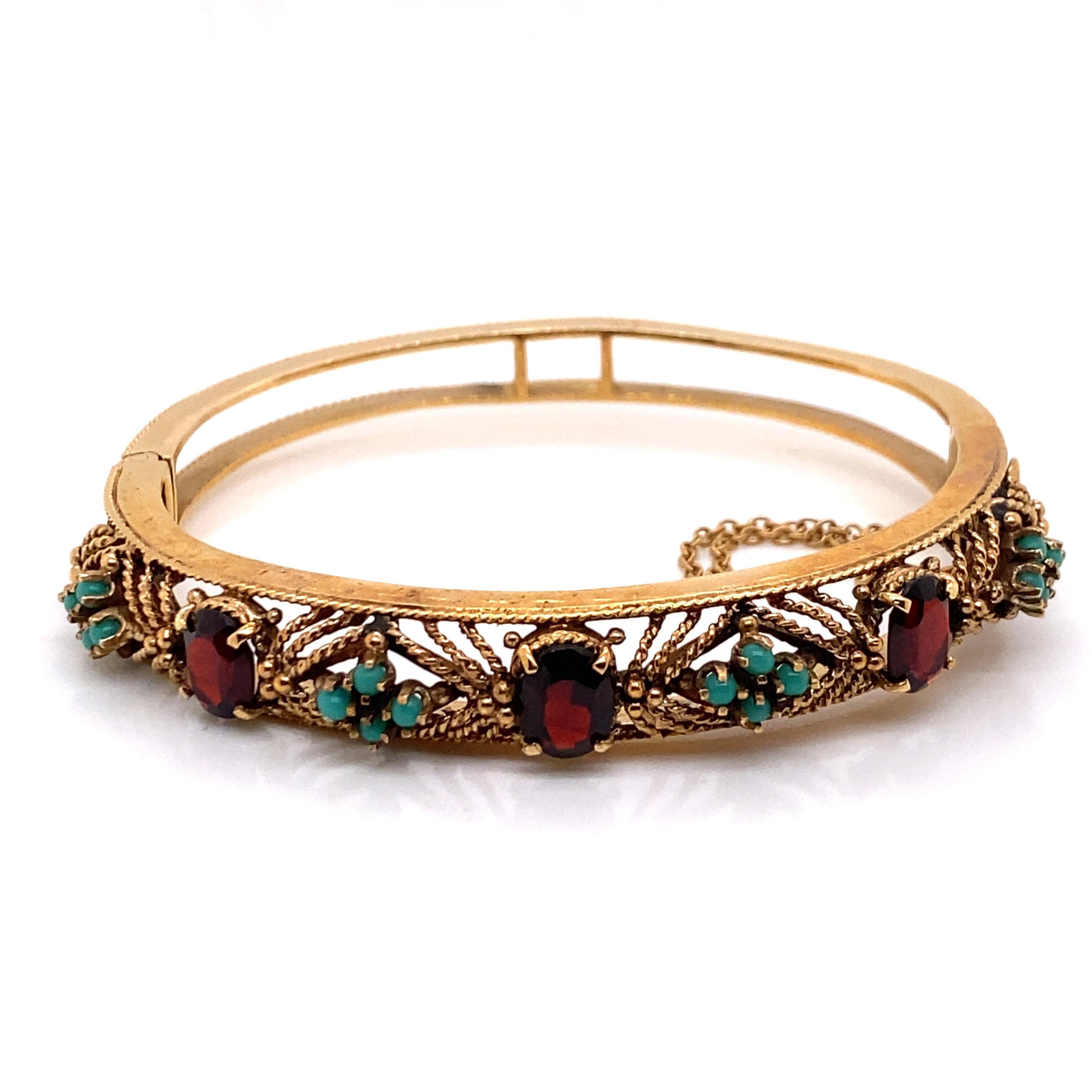 Vintage 1960's 14K Yellow Gold Bangle Bracelet with Garnet and Turquoise - The bangle contains 3 oval garnets 7.8 x 6mm and 16 turquoise beads which are prong set with filigree workmanship. The bangle width is .45 inches. The inside diameter is 1.85