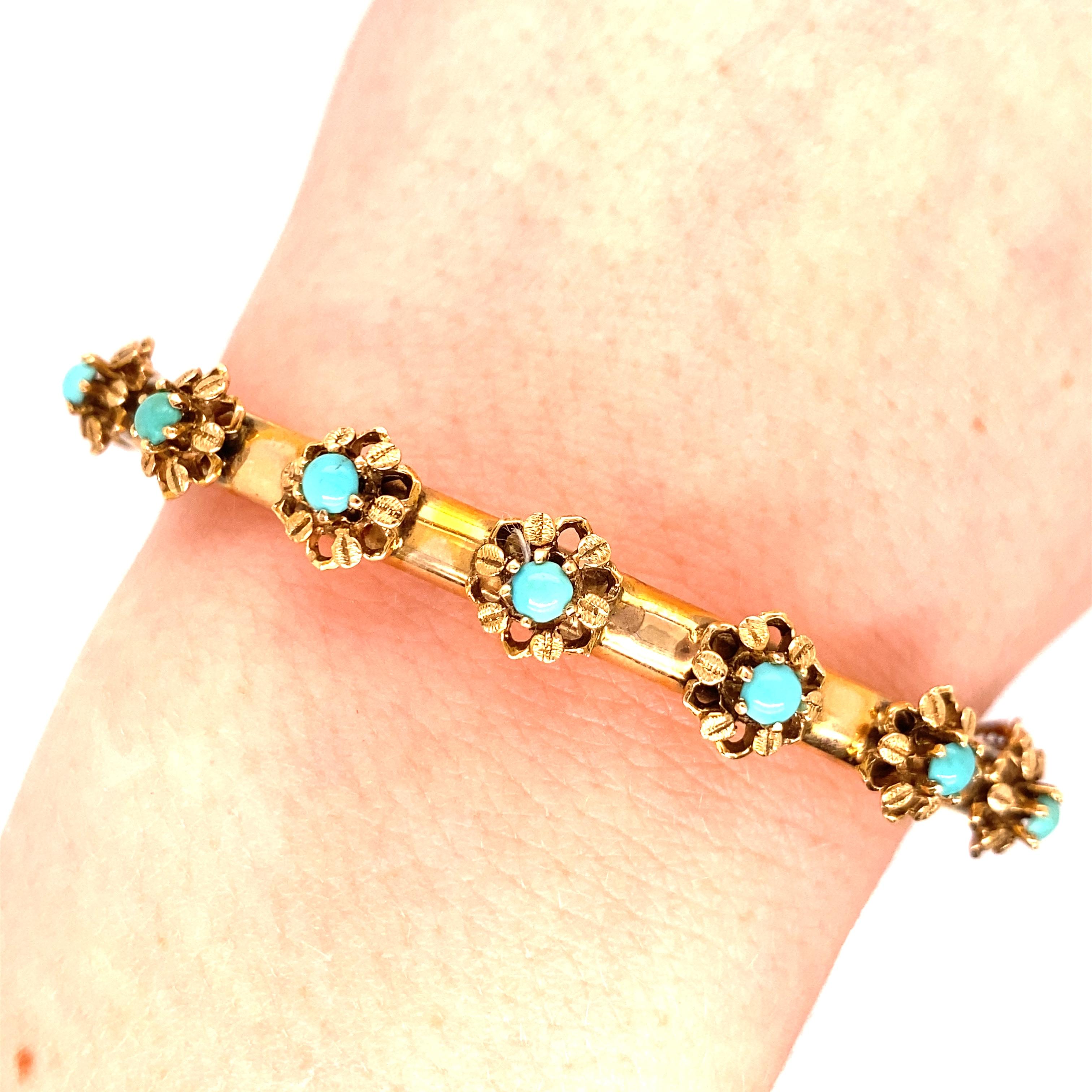 Vintage 1960's 14K Yellow Gold Bangle with Turquoise Stones - The bangle contains 7 turquoise stones set in 6 prong heads with a flower base that measure about .25 inches wide. The inside diameter is 2 inches high by 2.35 inches wide. The bracelet