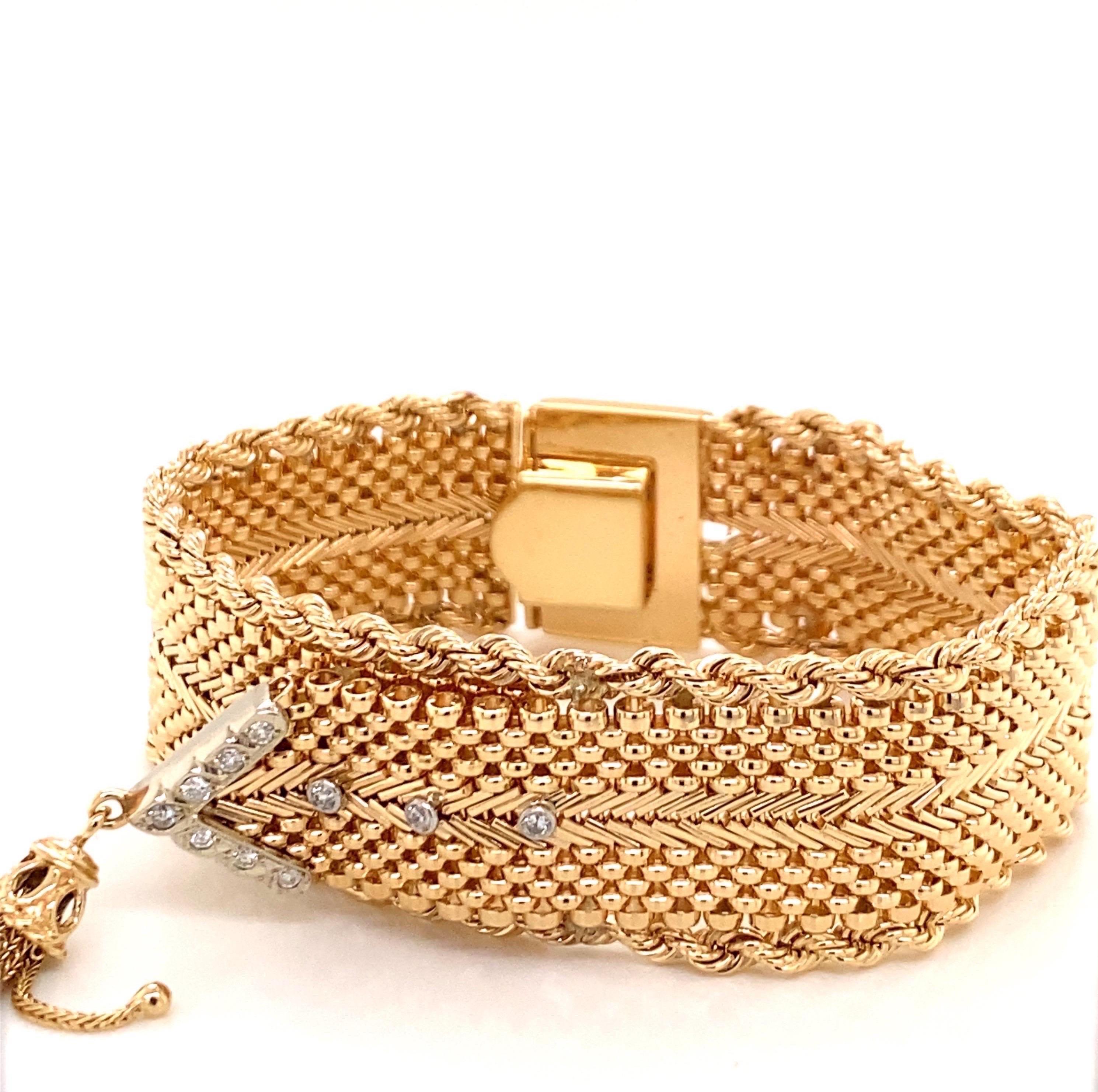 Vintage 1960's 14K Yellow Gold Mesh Belt Bracelet - The bracelet measures 6.9 inches long and .6 inches wide. The bracelet features a mesh design with a gold rope edge. The belt design has 10 round diamonds and a tassel hanging off the end. The