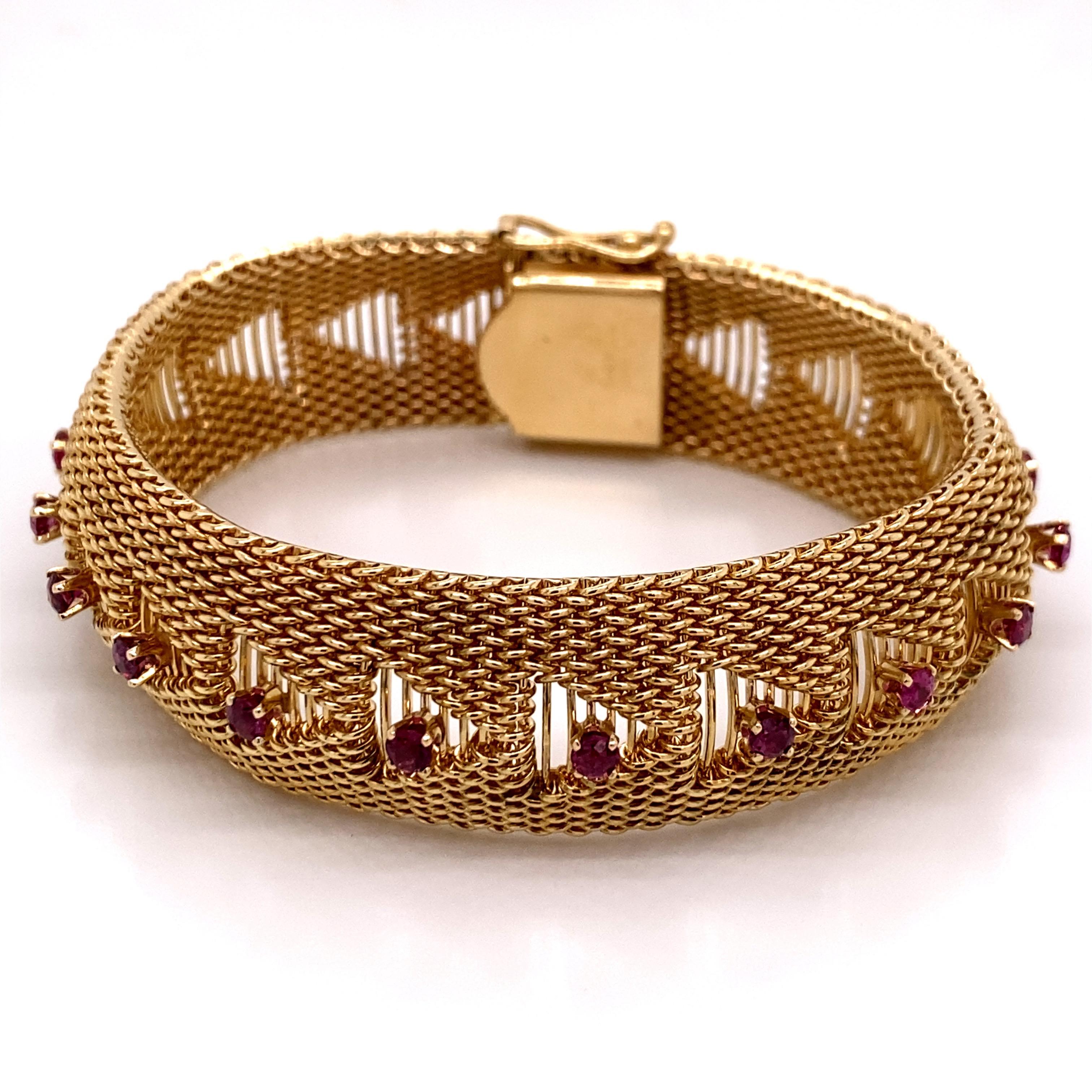 Vintage 1960s 14K Yellow Gold Mesh Bracelet with Enamel Flowers and Rubies - The bracelet measures 7 inches long and .6 inches wide in the center. The 12 Rubies are set in 4 prong heads and weigh approximately 1.25ct. The bracelet features a hidden