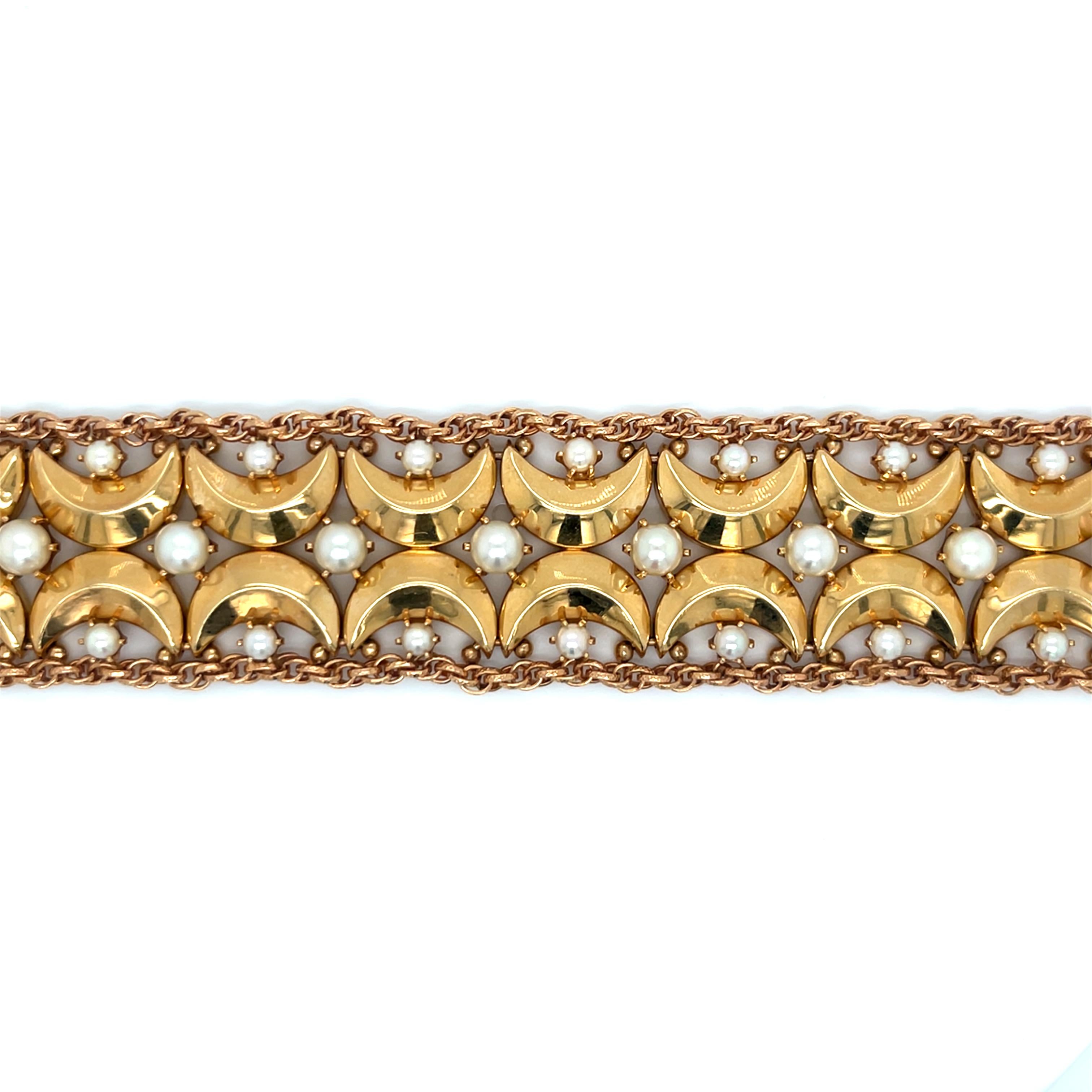 Vintage 1960's 14k Yellow Gold Wide Bracelet with Pearls

This stunning vintage 14k yellow gold bracelet from the 1960s is a true statement piece that embodies the era's bold, glamorous aesthetic. Measuring 7 inches in length and an impressive 1