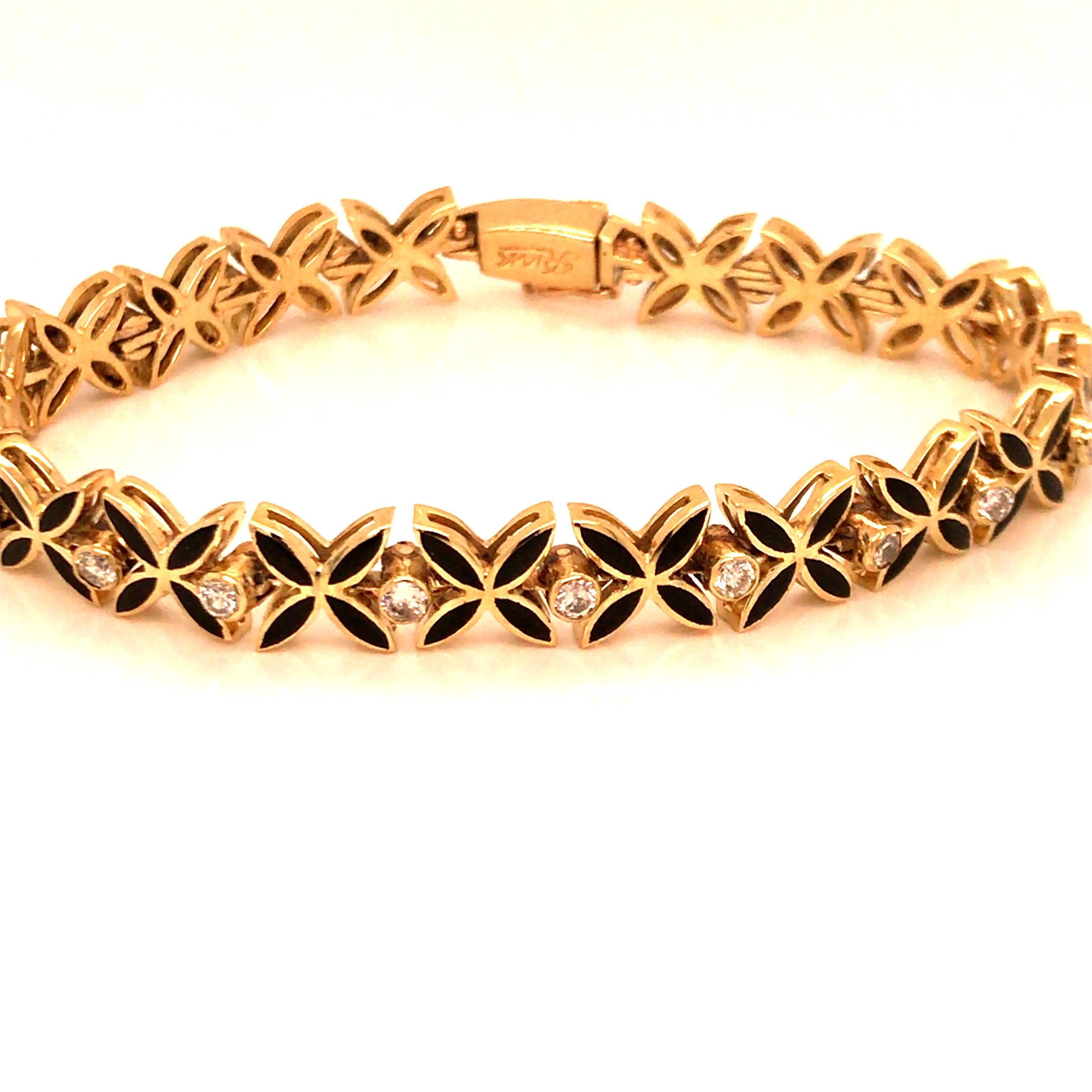 Vintage 1960's 14kt Yellow gold diamond and black enameled bracelet with 18 round cut diamonds - weighing approximately .75ct total, G/H color, SI1/SI2 clarity. Each diamond is bezel set in between an “x” link made up with 4 sections of a marquis