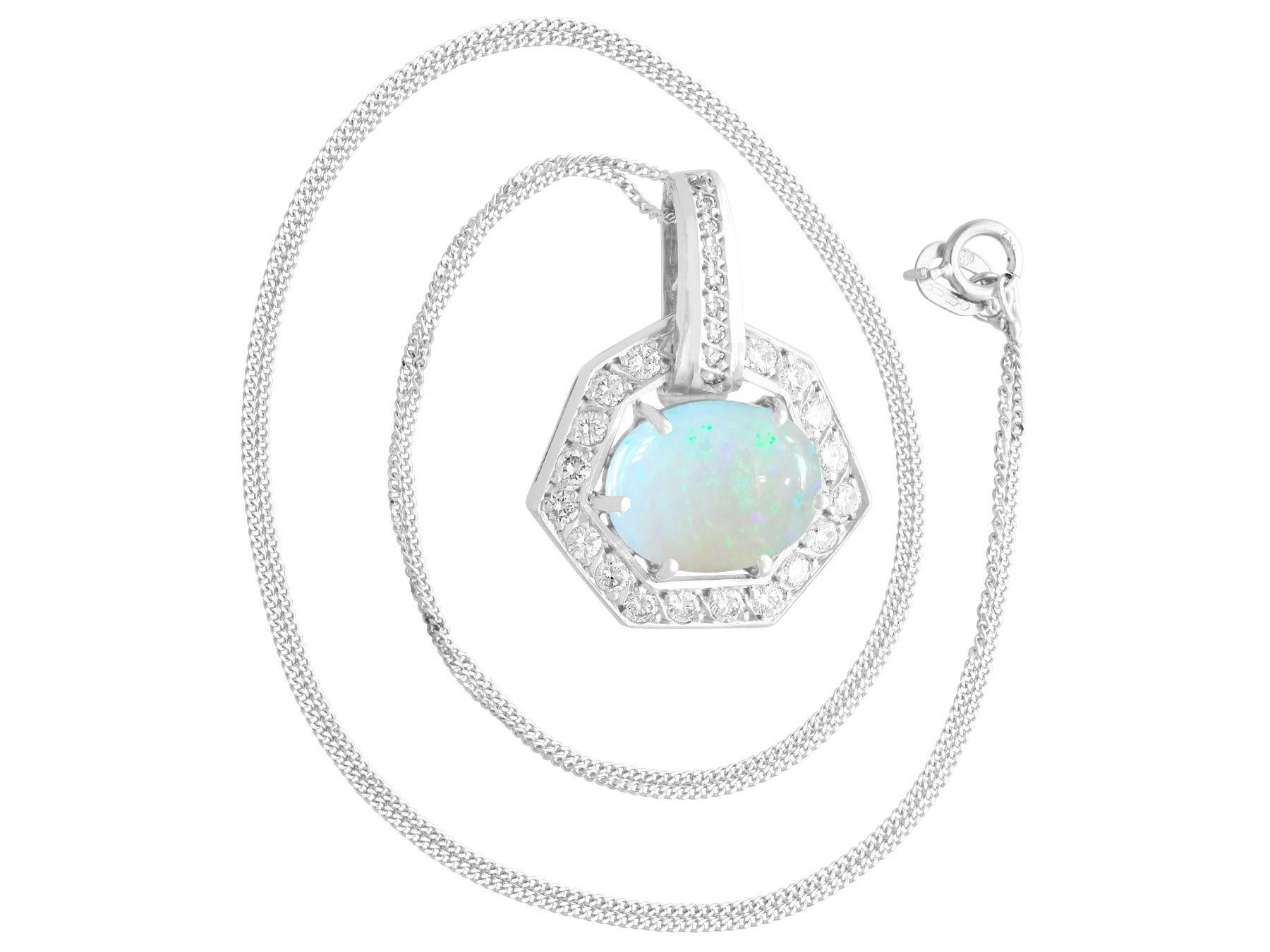 A fine and impressive 1.65 carat white opal and 0.68 carat diamond, 18 karat white gold pendant; part of our diverse jewelry collections

This fine and impressive cabochon cut pendant has been crafted in 18K white gold.

The pierced decorated,