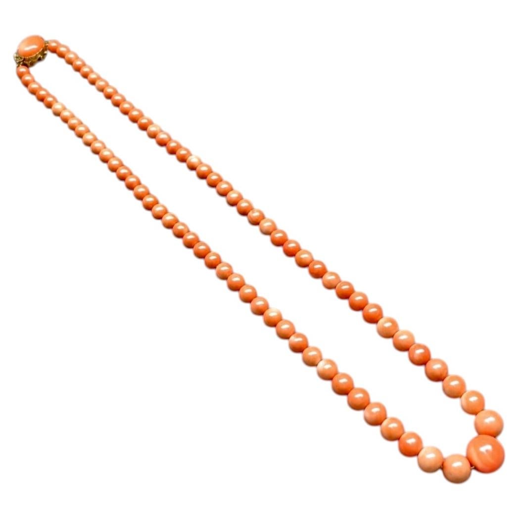 Vintage 1960’s 18K Yellow Gold Pink Coral Graduating Beaded Necklace 13.50mm 20”