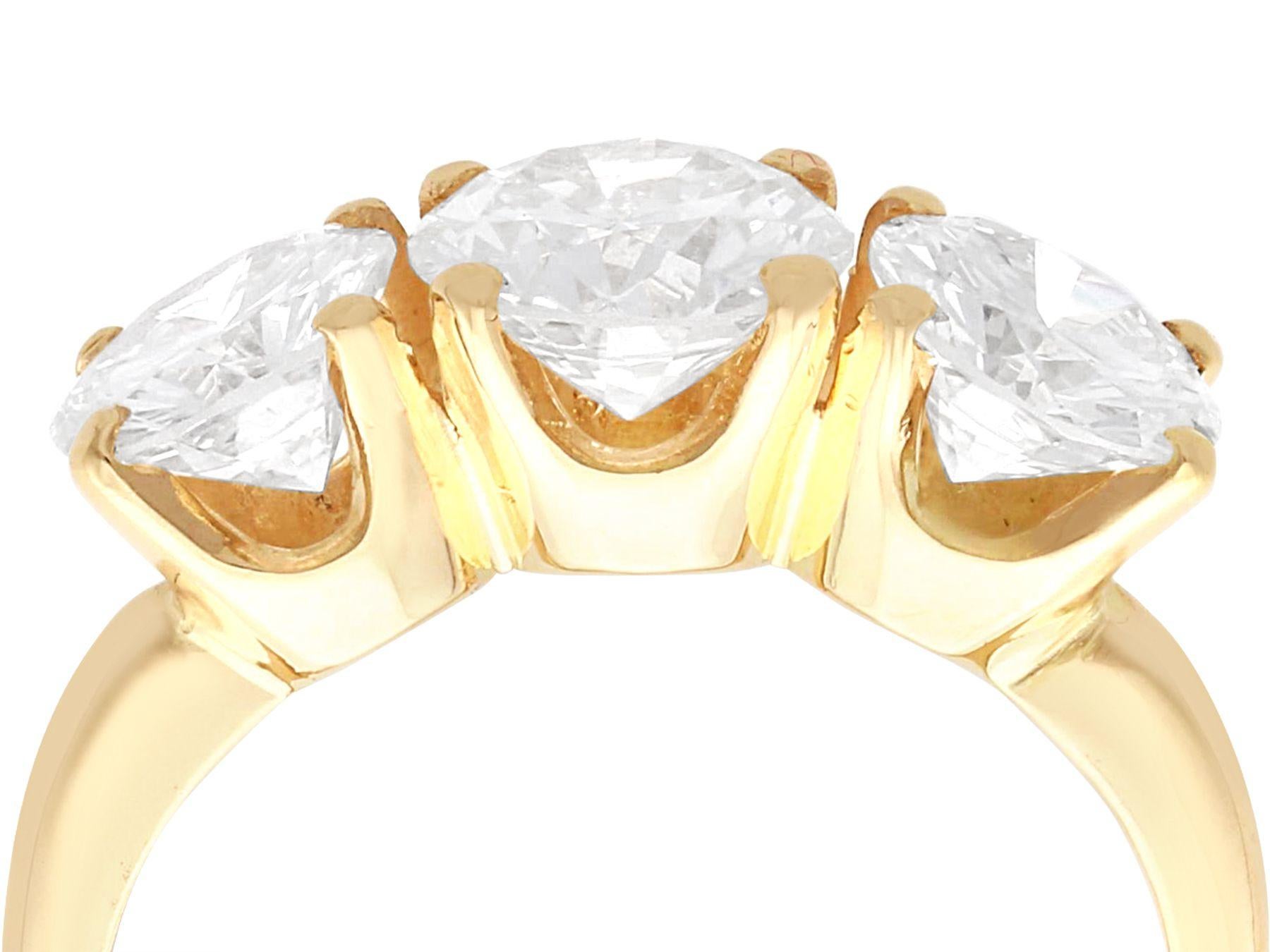 A stunning, fine and impressive vintage 3.49 carat diamond and 14 karat yellow gold trilogy ring; part of our diverse vintage diamond jewelry collections

This stunning, fine and impressive vintage trilogy ring has been crafted in 14k yellow