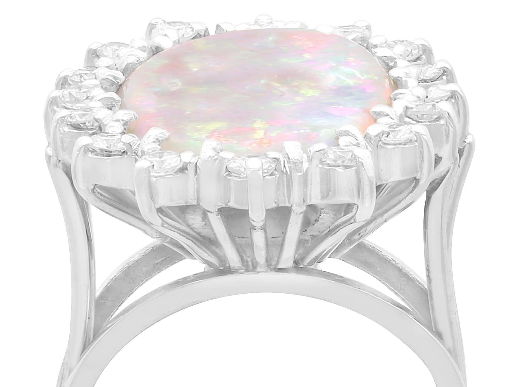An impressive vintage 5.15 carat opal and 0.48 carat diamond, 14 karat white gold dress ring; part of our diverse opal jewelry and estate jewelry collections.

This fine and impressive 1960s vintage cabochon cut opal and diamond ring has been