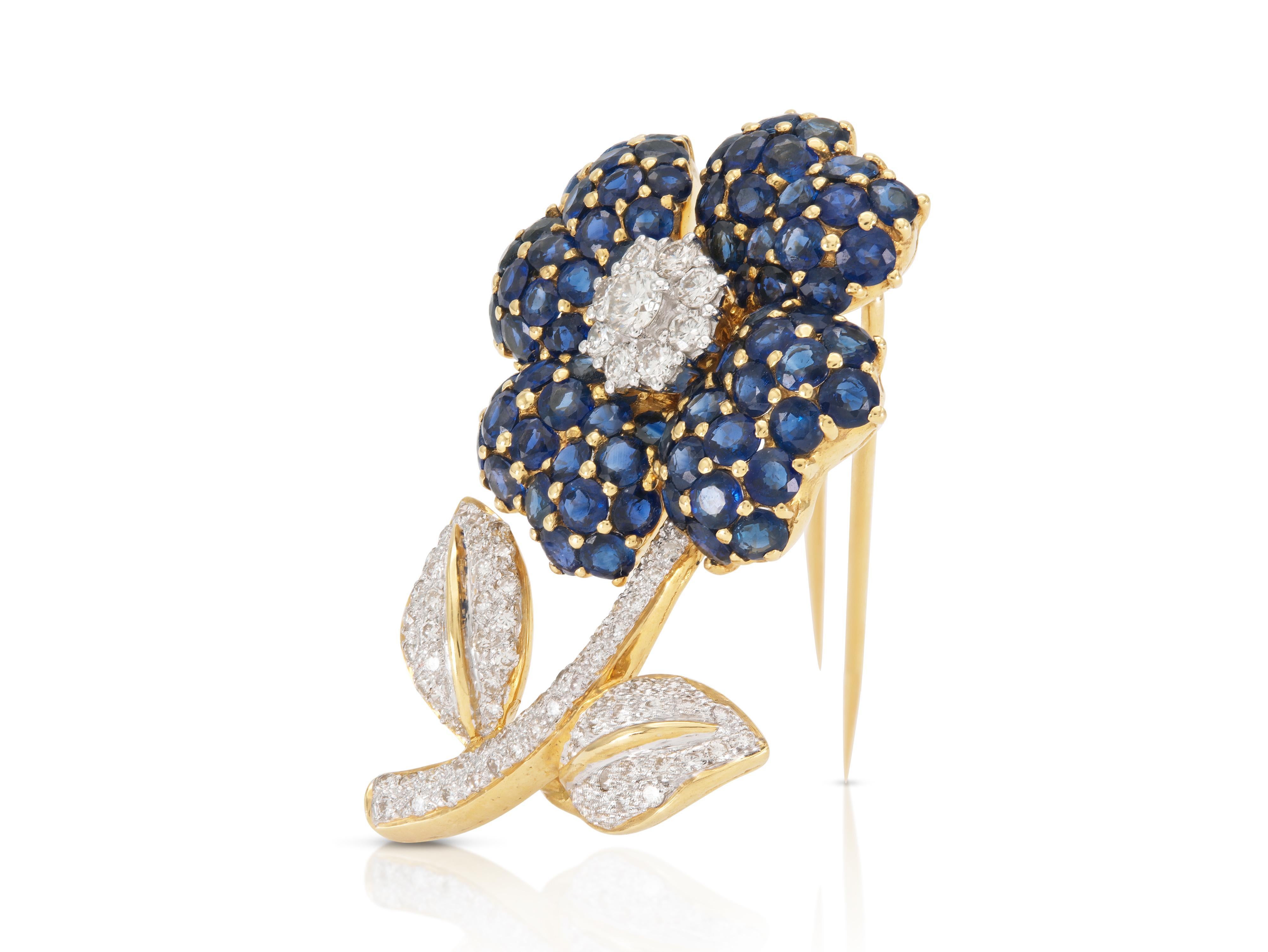 Finely crafted in 18k yellow and white gold with Round cut Sapphires weighing approximately a total of 6.30 carats and Round Brilliant cut Diamonds weighing approximately a total of 1.30 carats
Circa 1960s
1 5/8 x 1 inch