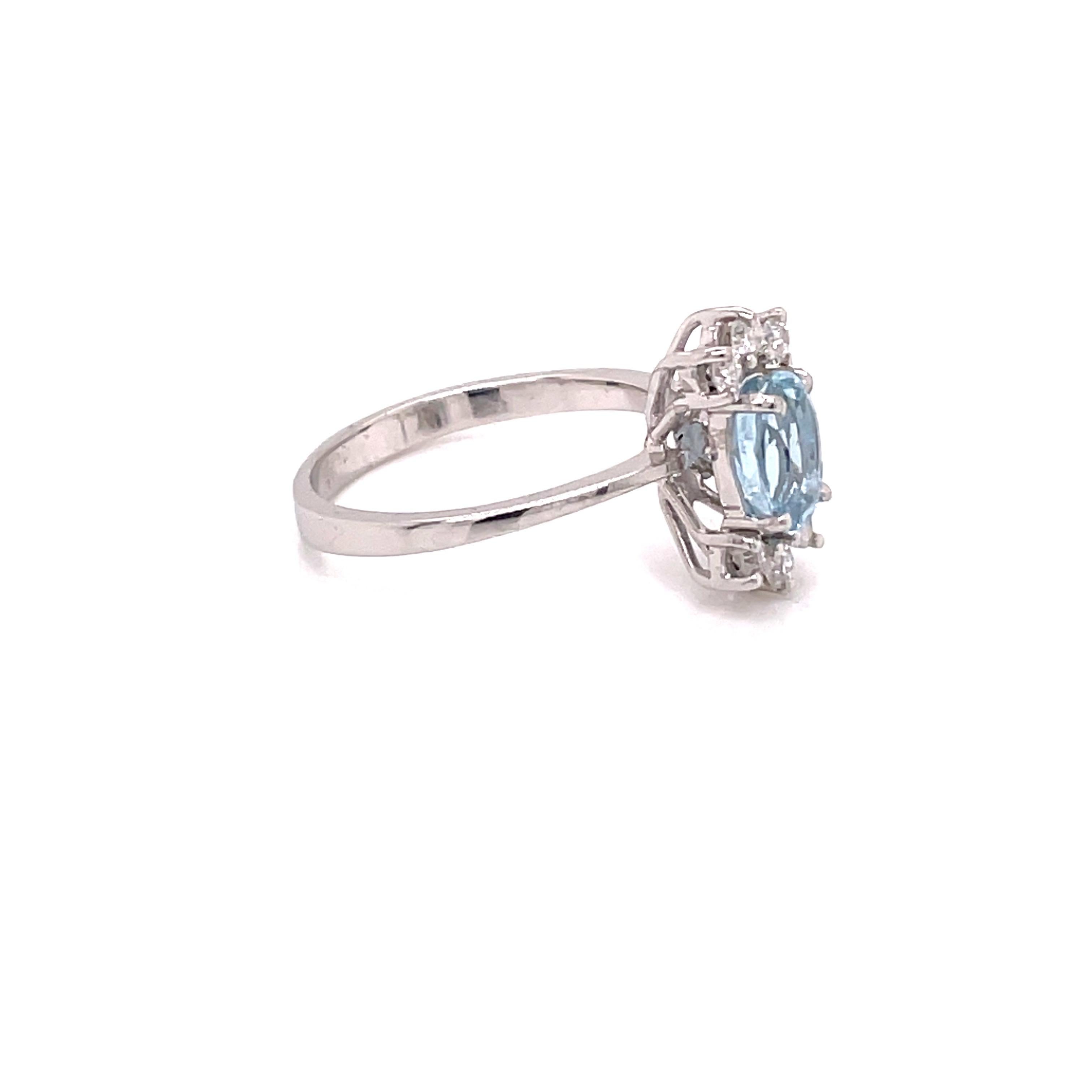 Contemporary Vintage 1960's .75ct Oval Cut Aquamarine Ring with Diamonds For Sale