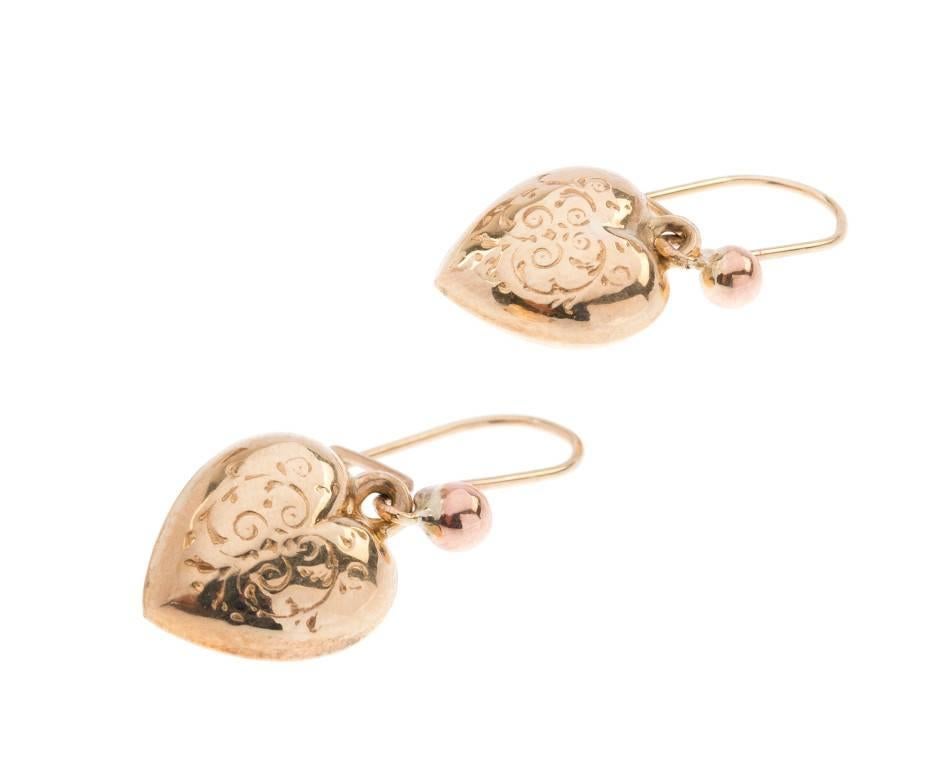 This fabulous pair of Ladies vintage 1960's drop earrings...

Each designed as a with a petite heart shape drop, with beautiful scroll detail, suspended from an elegant sphere surmount. A pretty pair, that will effortlessly take you from desk to
