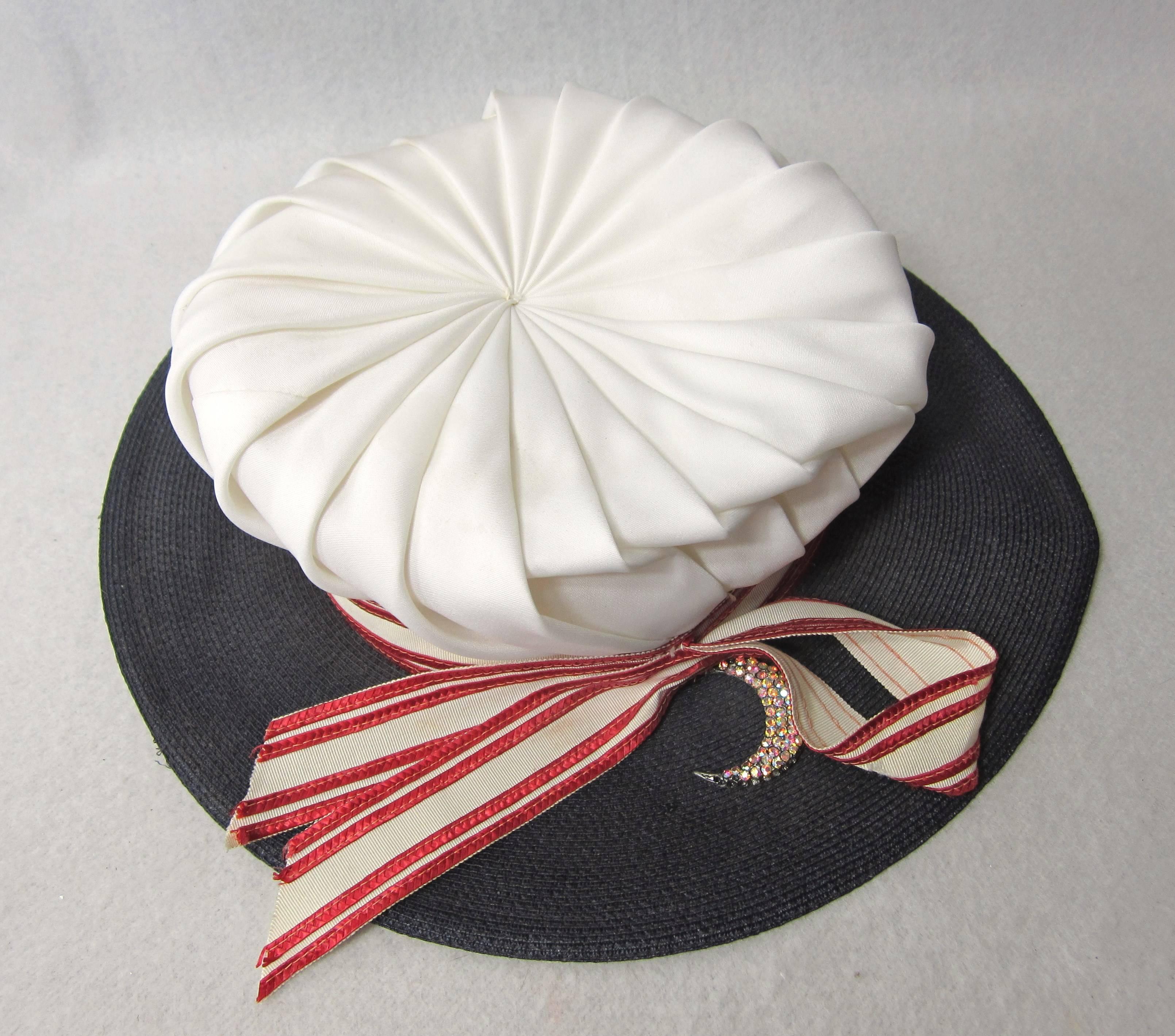 This is a show shopper!. Paul Bensam White topped Accordion pleated with Red and White Wide Ribbon and Blue Straw brim. It comes with a Crescent moon pin attached. The hat is approximately  7-1/4. 4.75 inch Brim. Sits up 4 inches. We have been