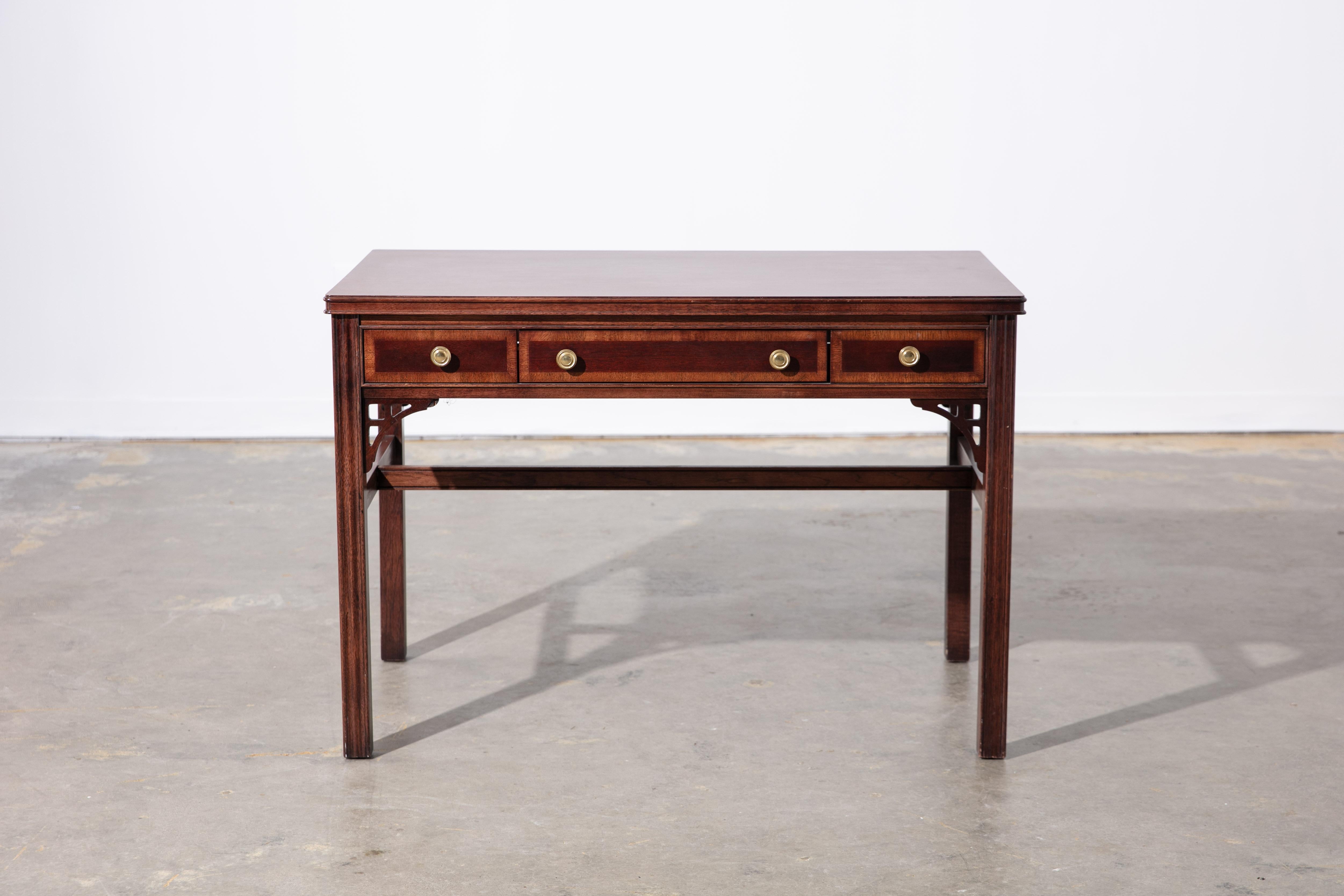Vintage 1960's American of Martinsville desk with structural details and original pulls. Nice corner details. Marked inside drawer. Two faux drawers, one center drawer. 
32.25