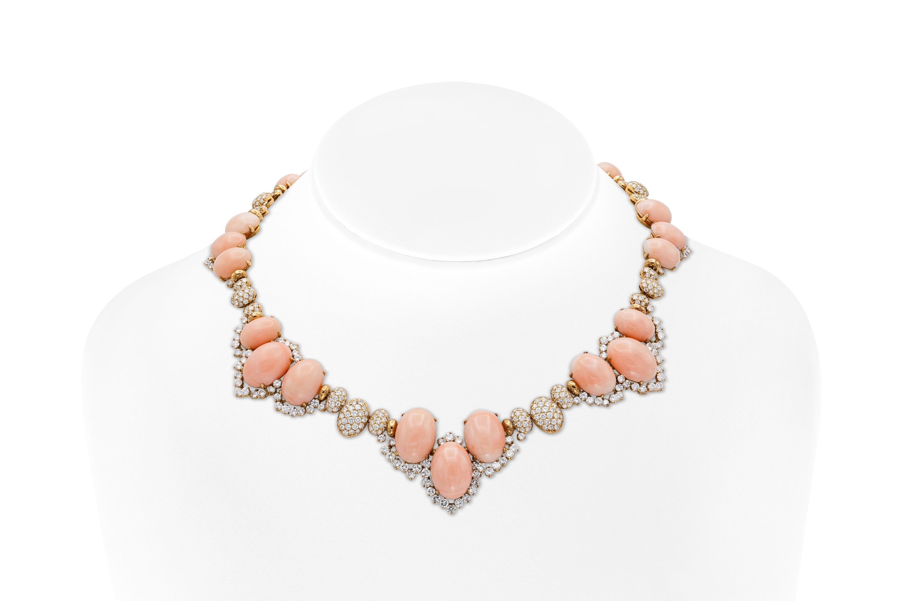 Finely crafted in 18k yellow gold with Angel Skin Corals and Round Brilliant cut Diamonds weighing approximately a total of 28.00 carats.
Circa 1960s
Necklace: 16 1/2 inches long
Bracelet: size 6 1/2 inches
Earrings: 1 inch long