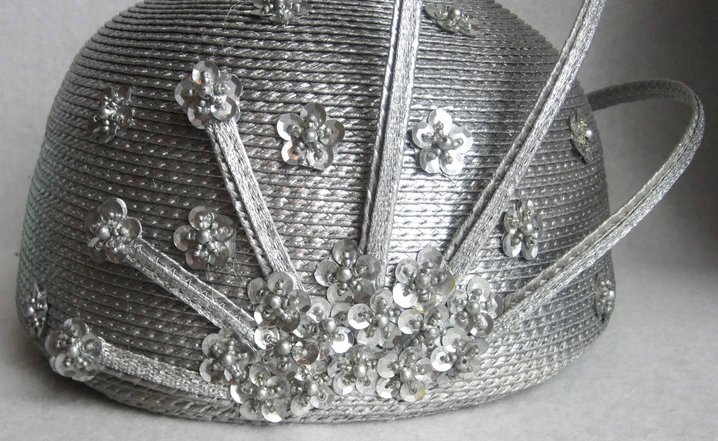 Stunning silver Sculptural hat that will beam you up! Sequins scattered at the sides. Interior circumference 22 in. Approx. size 7. We have been selling on this platform since 2013 so be sure to check our storefront for hundreds of items including