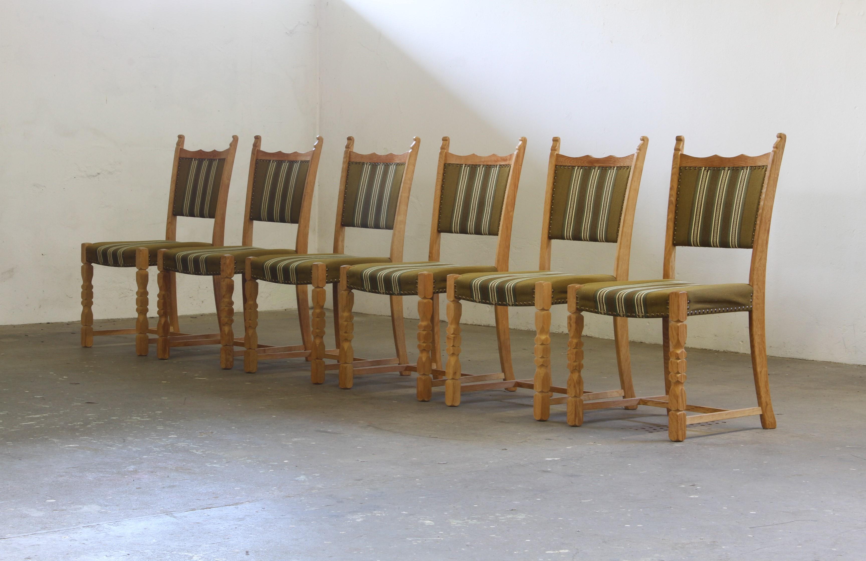 Crafted in Denmark in the 1960s/70s, inspired by Henning Kjærnulf’s Brutalist / Baroque Bold style. Each chair is solid with no damage to the wood, and in good shape though we recomend a reupholstery in the near by future.

The wood has developed a