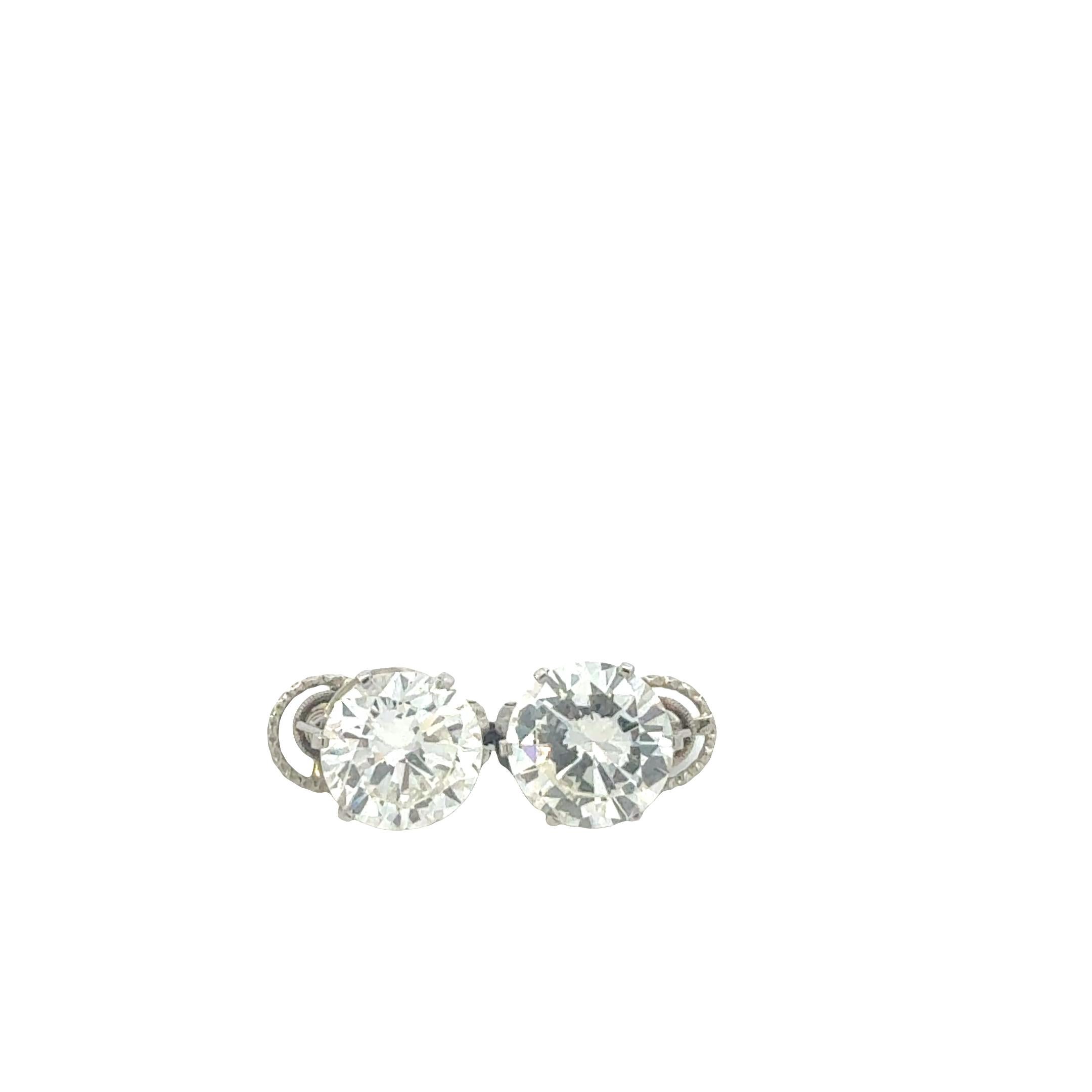 Vintage 1960s Bulgari Platinum Stud Earrings – 2 Round Diamonds, 5.00 & 5.32 cts Corte redondo en venta