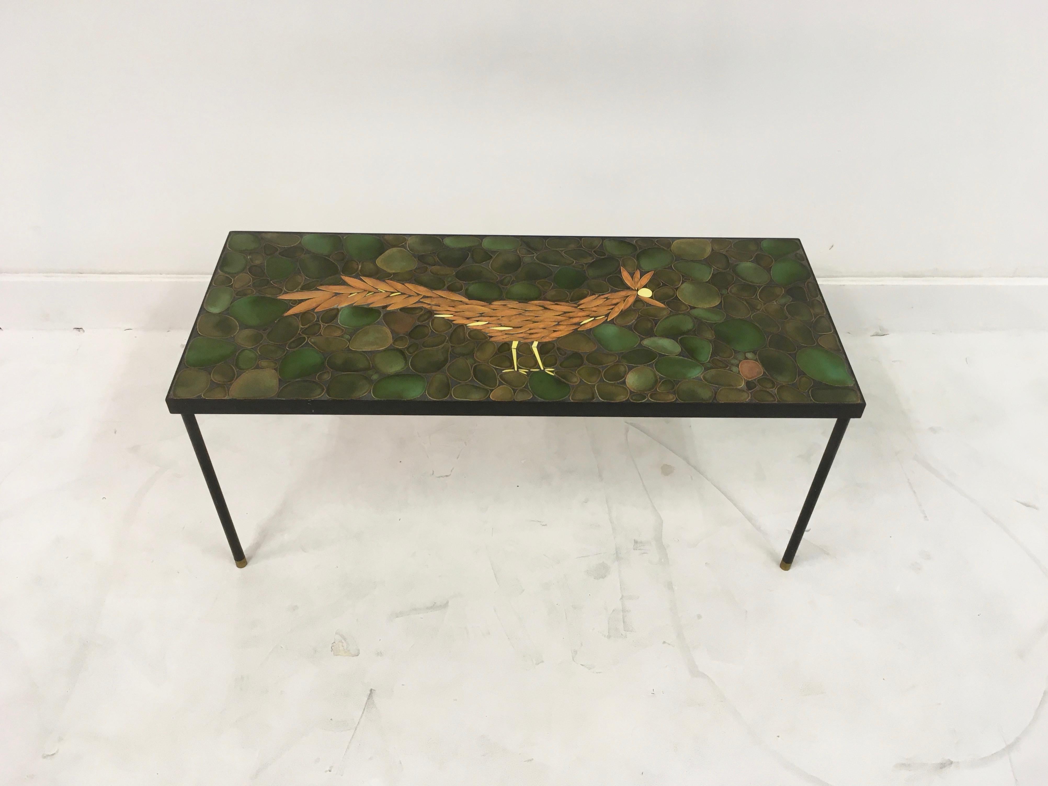 Ceramic topped coffee table

Black painted steel base

Brass feet

1960s-1970s.