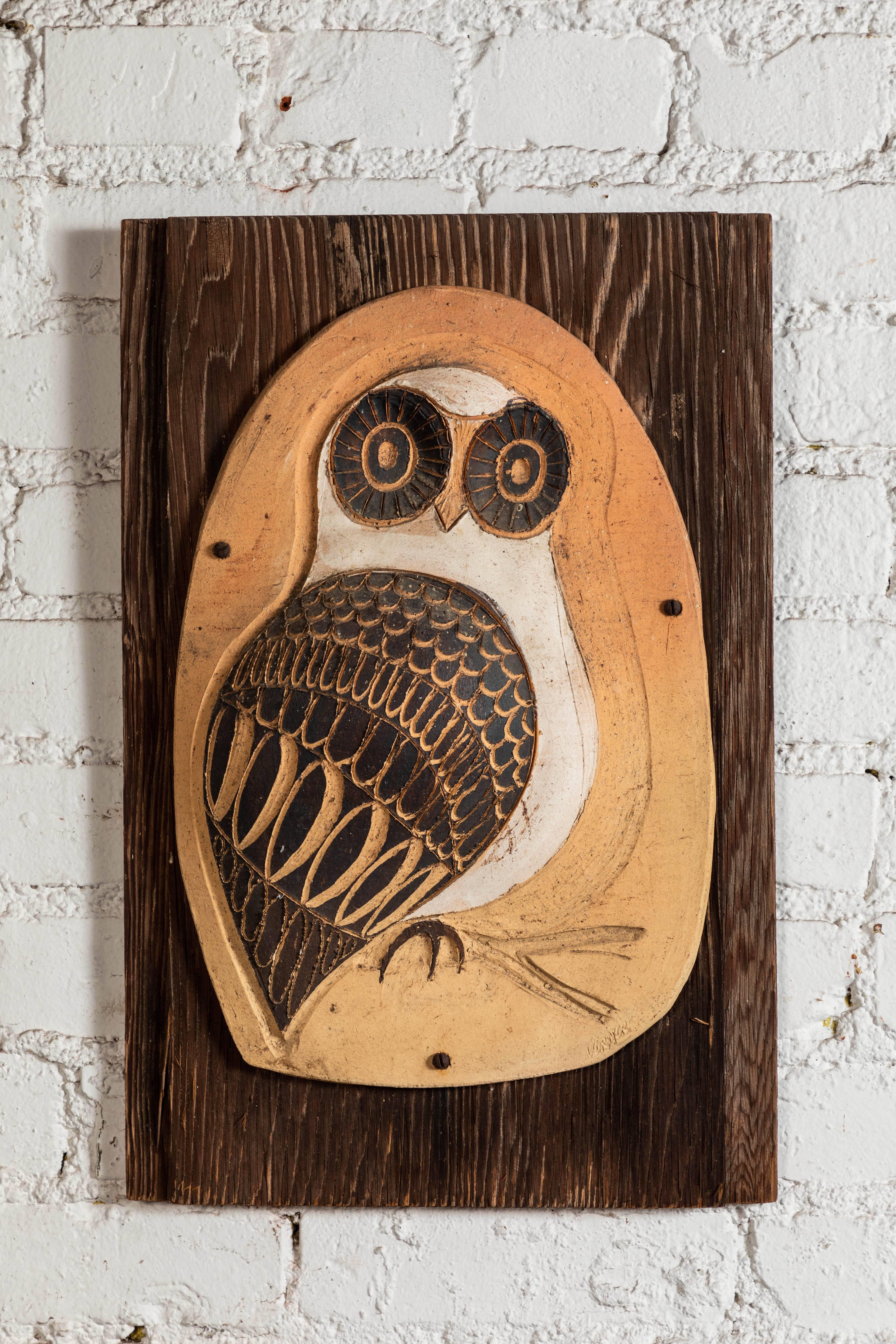 Vintage 1960s clay and wood owl wall art in great condition. 

Measures: 12.5 W, 18 H.