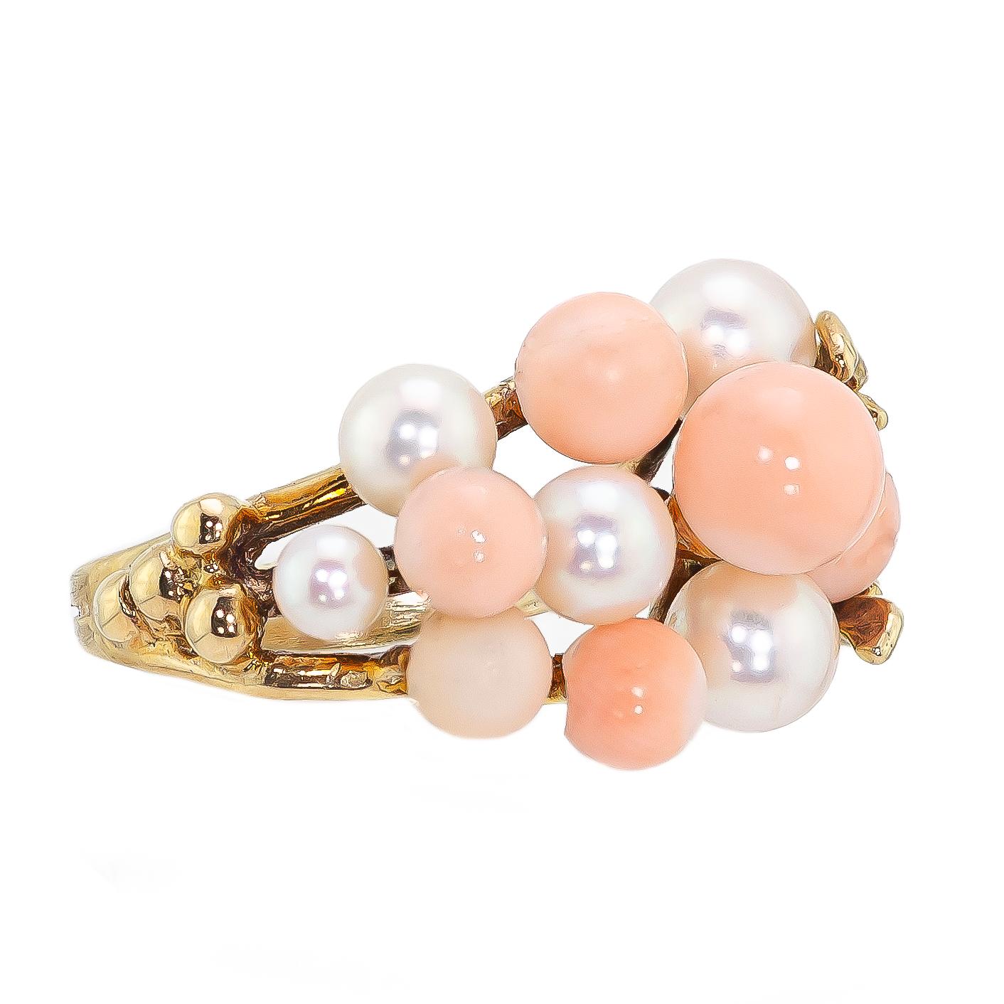 Vintage 1960 coral cultured pearl and yellow gold ring set with a variety of round differing sizes light pink coral beads and cultued pearls set into a 