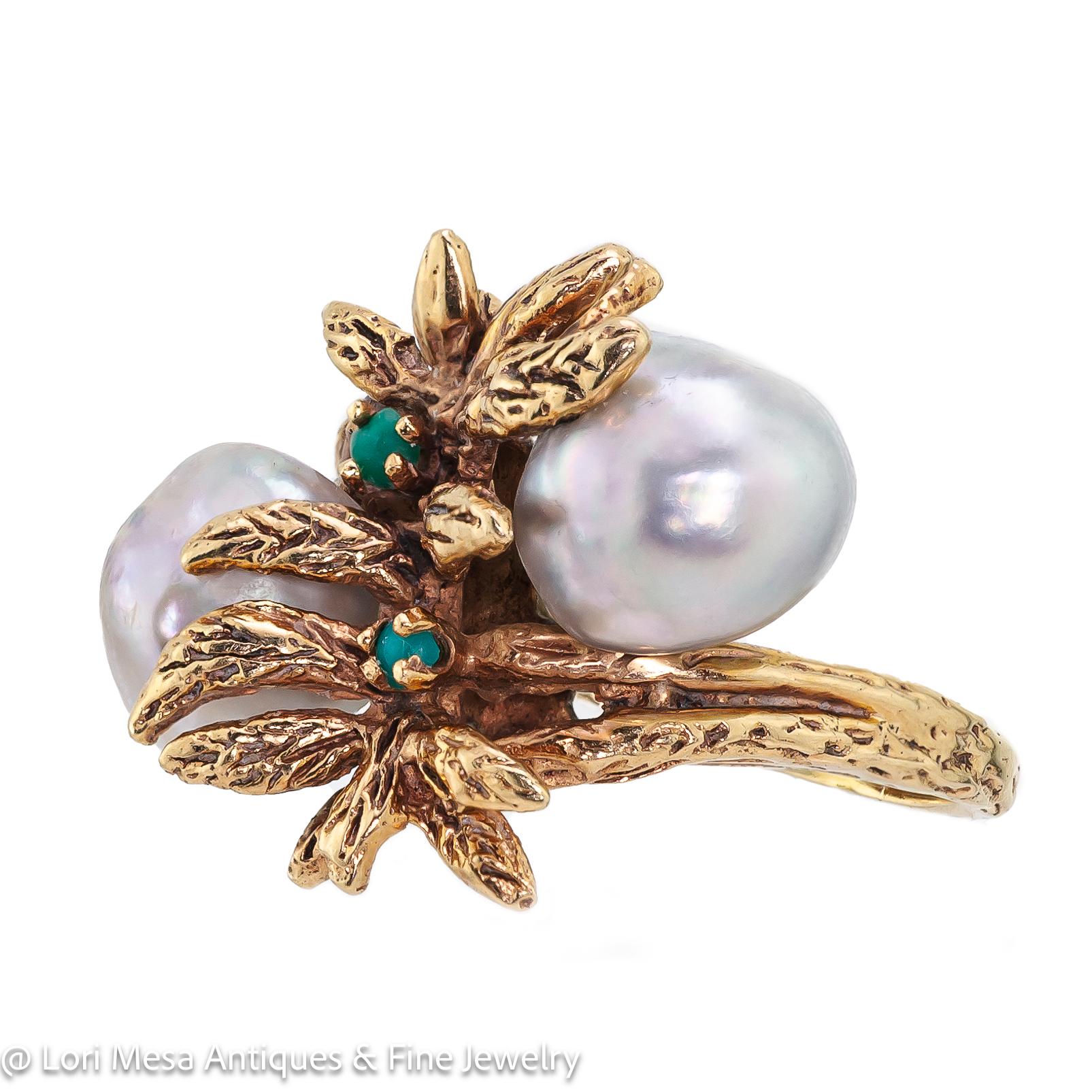 Vintage 1960s cultured pearl emerald and 14kt yellow gold ring - two grey baroque pearls, two small round emeralds, textured finish foliate design crossover mount.
