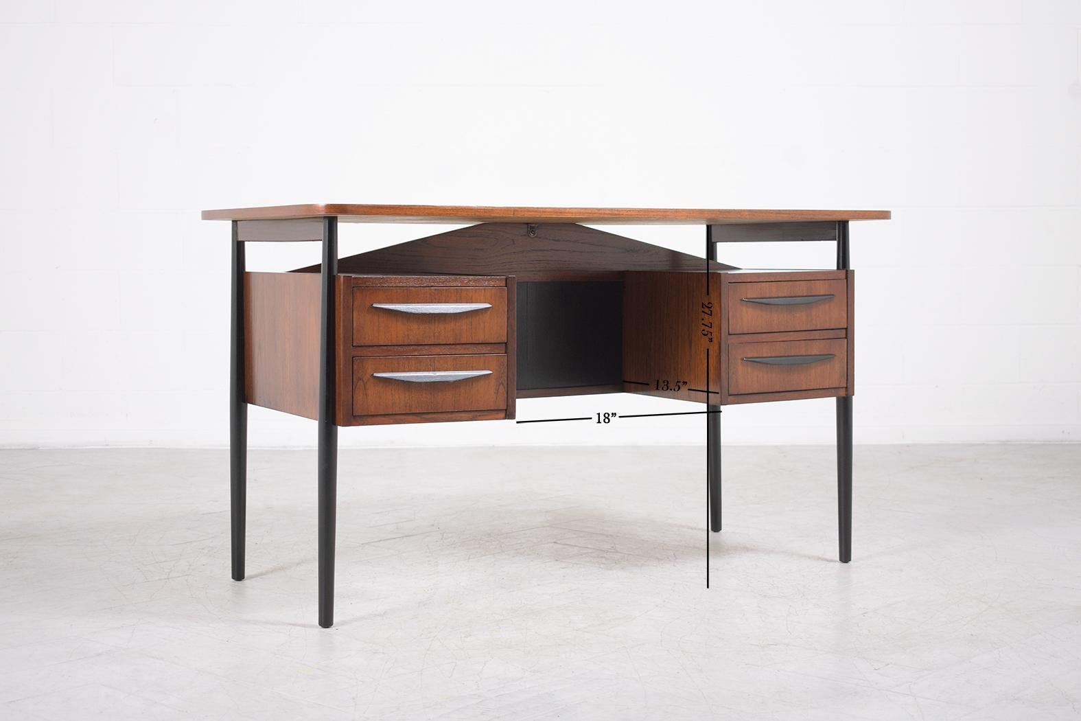 An extraordinary 1960s danish desk in great condition completely restored and refinished by our professional craftsmen team. This sleek mid-century is hand-crafted out of teak wood and has been newly stained in two tones of provincial and ebonized