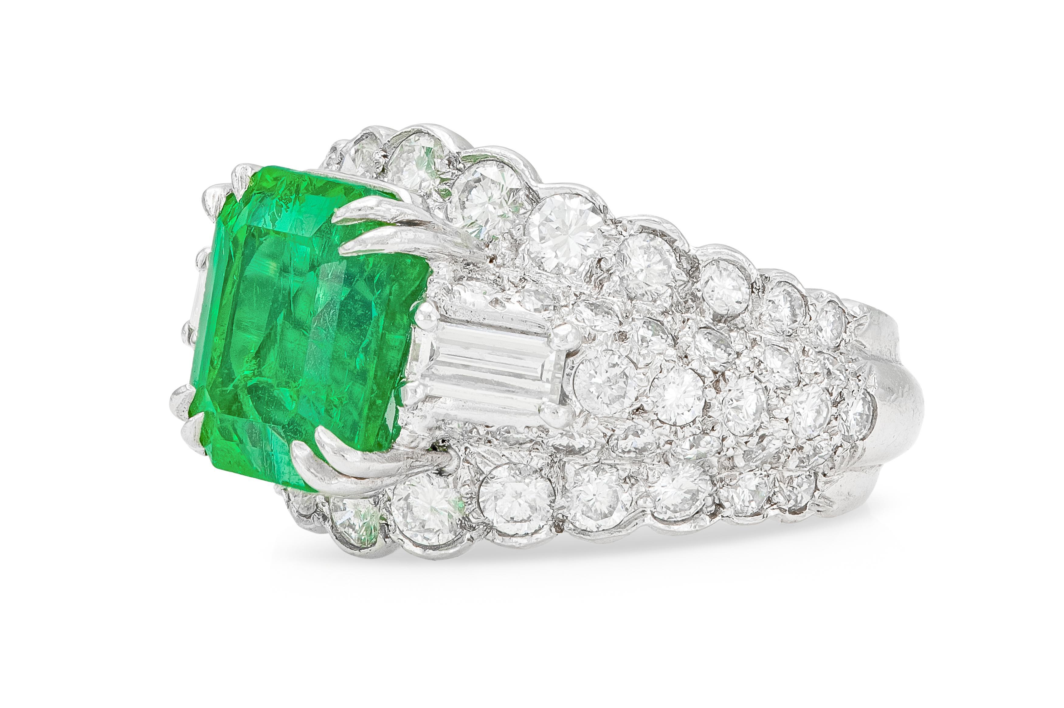 Finely crafted in platinum with an Emerald weighing approximately 6.00 carats, and Round Brilliant and Baguette cut Diamonds weighing a total of approximately 4.00 carats.
Signed by David Webb
Circa 1960s
Size 5 1/4