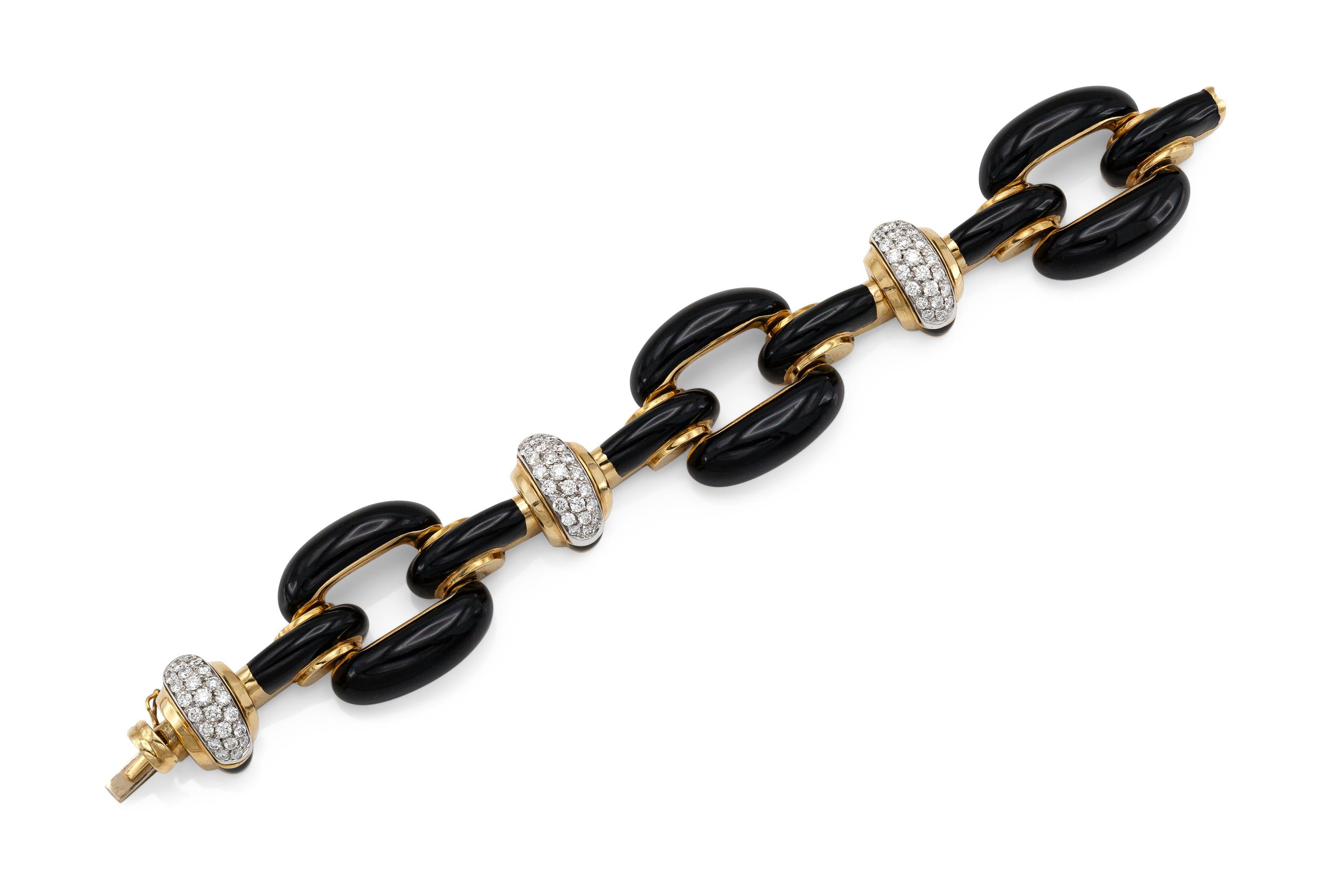Finely crafted with black enamel over 18k yellow gold with Round Brilliant cut Diamonds.
Signed by David Webb
Circa 1960s
Size 7 1/2 inches
