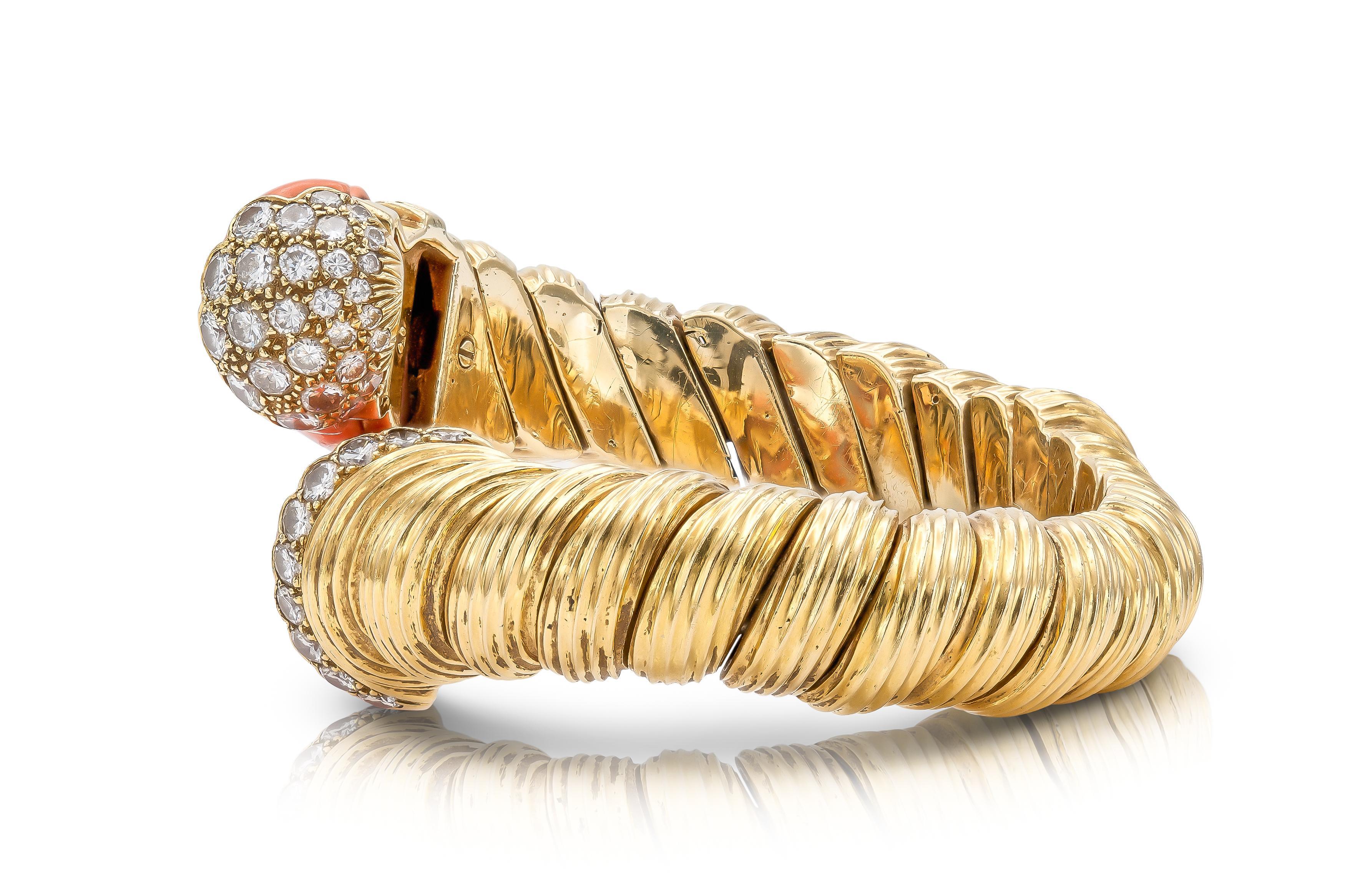 Finely crafted in 18k yellow gold with carved Coral and Round Brilliant cut Diamonds weighing approximately a total of 4.00 carats.
Signed by David Webb
Circa 1960s
Size 6 inches