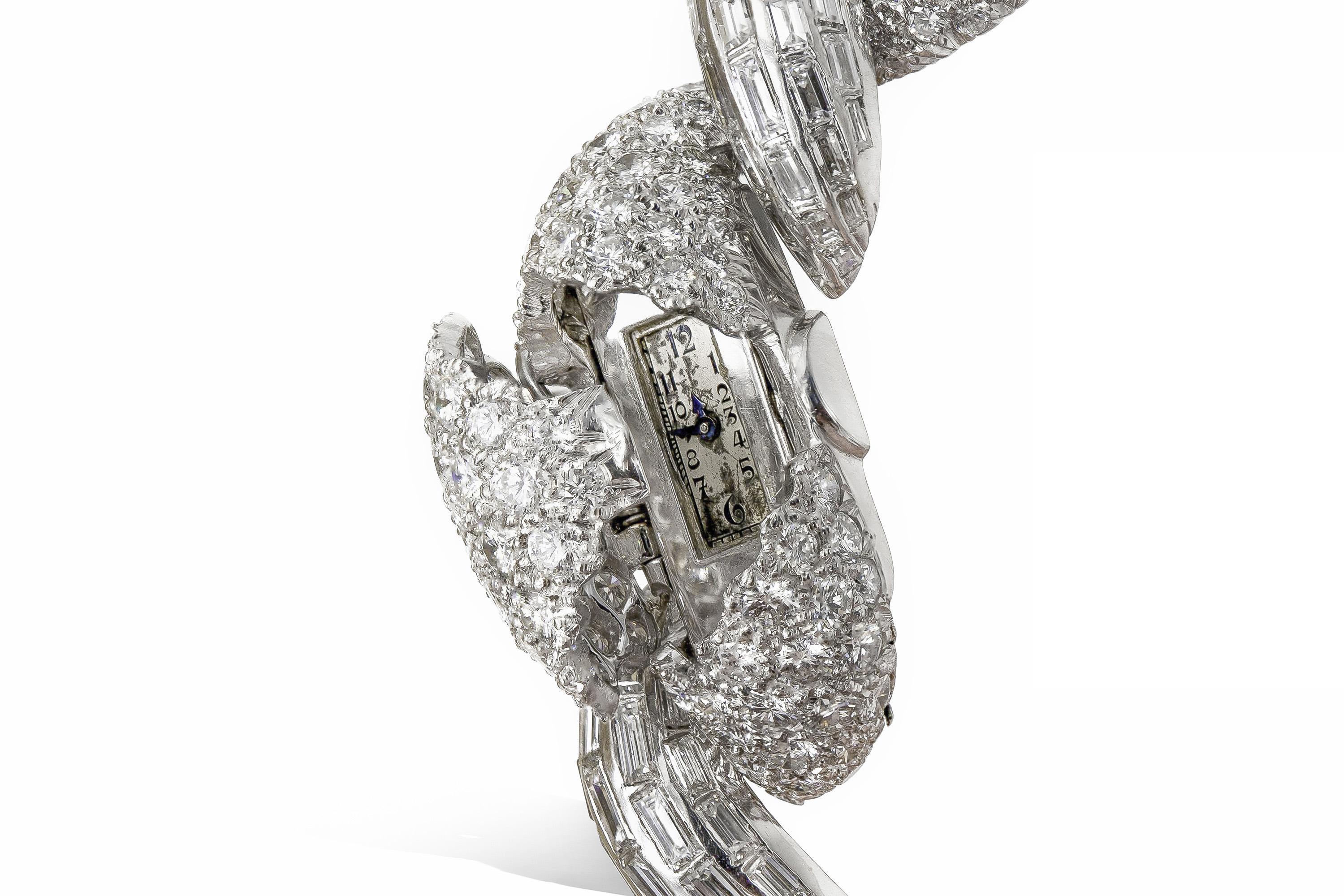 Finely crafted in platinum with Round Brilliant and Baguette cut Diamonds weighing a total of approximately 43.00 carats.
Signed by David Webb
Circa 1960s
Size 6 1/4 inches