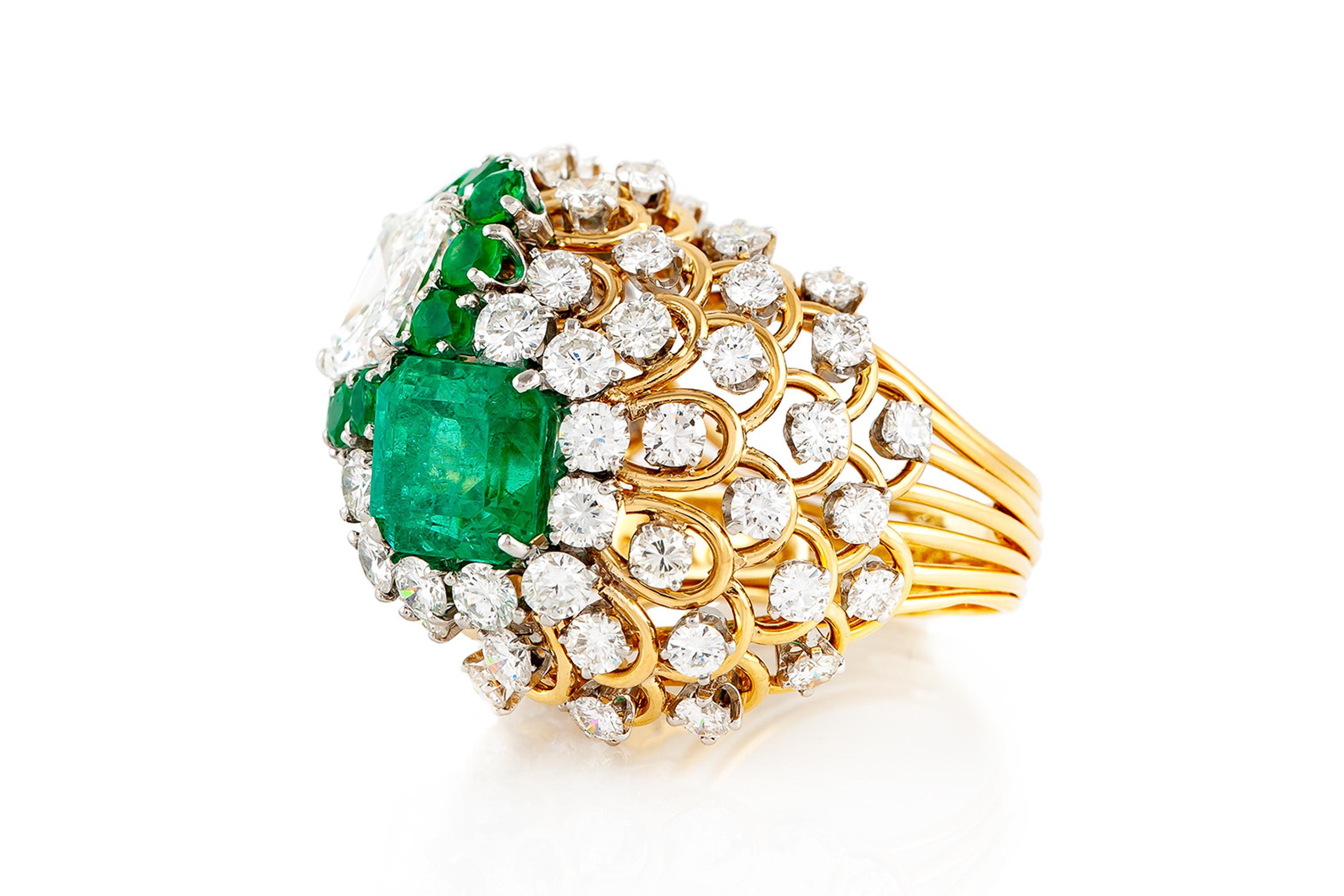 Finely crafted in 18k yellow gold and platinum with an AGL certified, Colombian origin Emerald weighing 4.43 carats, and a GIA certified Asscher cut Diamond weighing 3.10 carats, G color, VS2 clarity, GIA #1192096538.
The two stones are accented