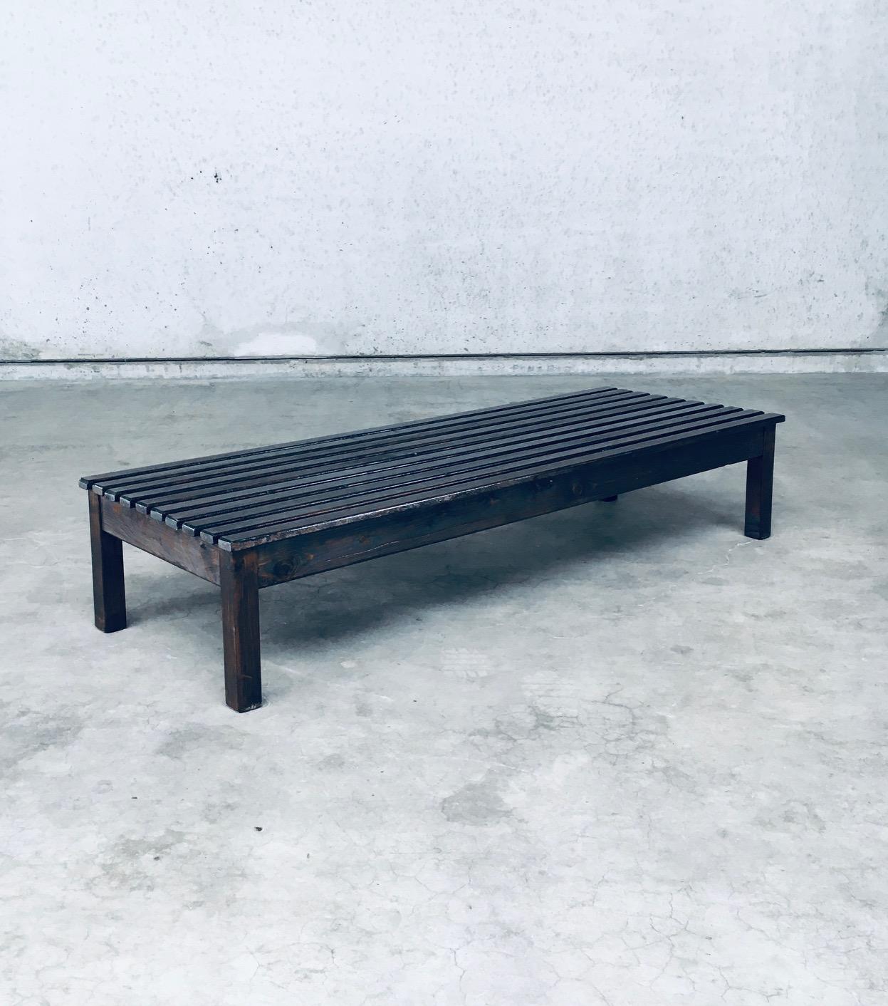 Vintage Midcentury Period Design Darck Stained Pine Low Slat Bench or Side Table. Made in the 1960's. No maker markings or references found. Dark stained pine wooden construction. This comes in very good condition. Measures 36cm x 178,5cm x 63cm.