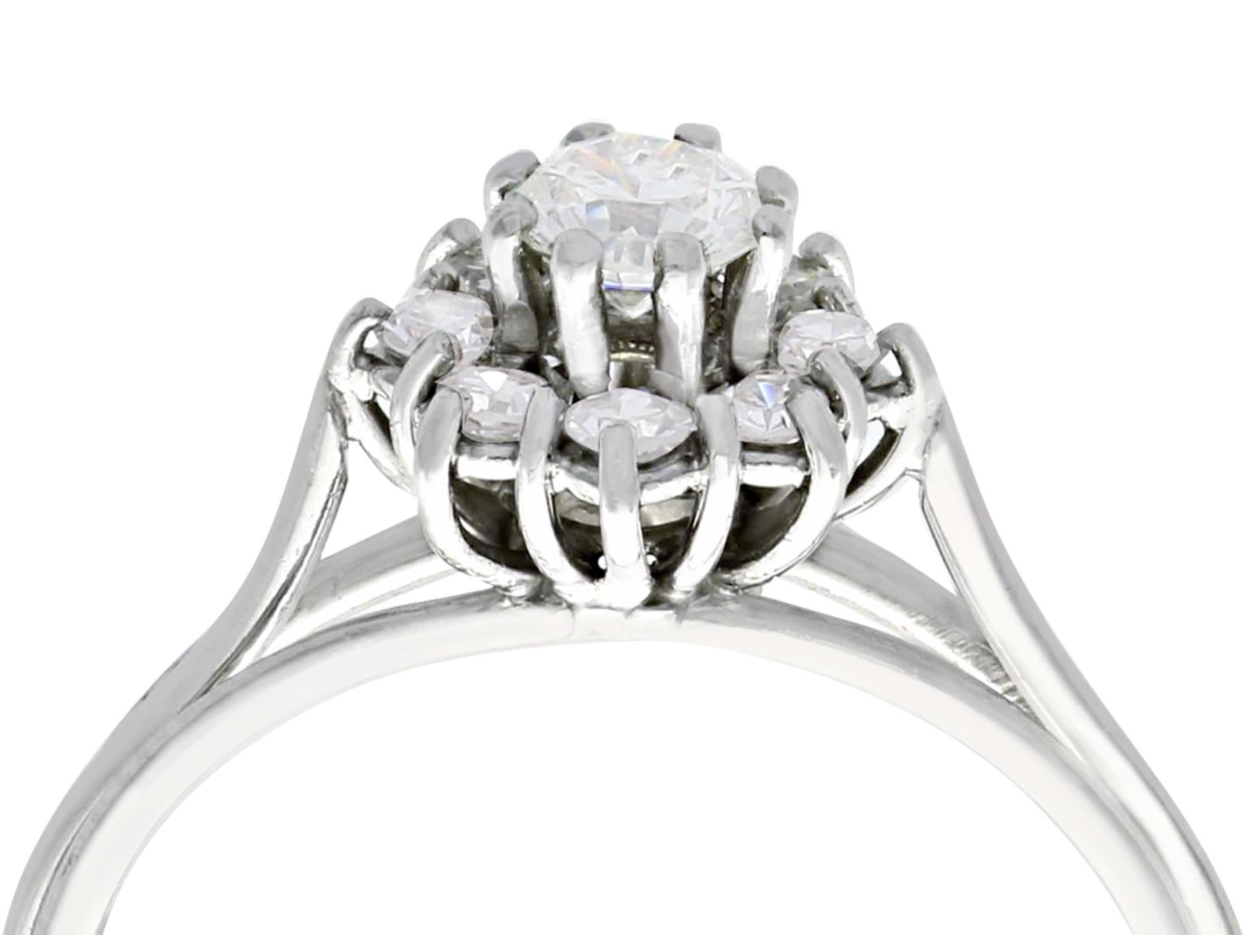 A fine and impressive 0.65 Carat diamond and 18 karat white gold cluster style dress ring; part of our diverse vintage jewelry and estate jewelry collections.

This fine and impressive vintage diamond cluster ring has been crafted in 18k white