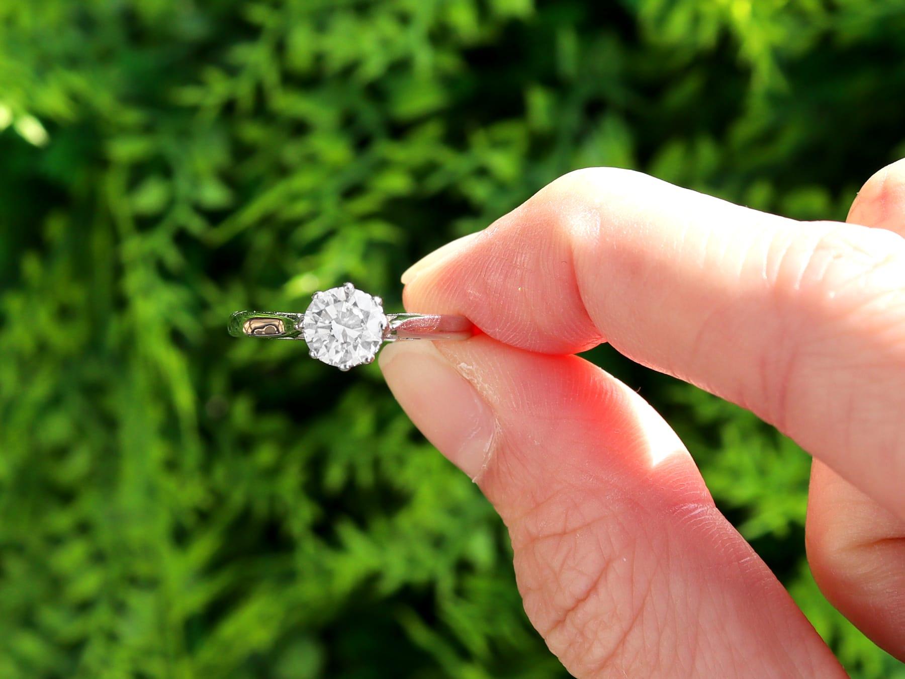 A fine and impressive 0.81 carat diamond and 18k white gold solitaire ring; part of our diverse diamond jewelry and estate jewelry collections.

This impressive vintage diamond (circa 1960) solitaire ring is displayed in a vintage (1972) 18k white