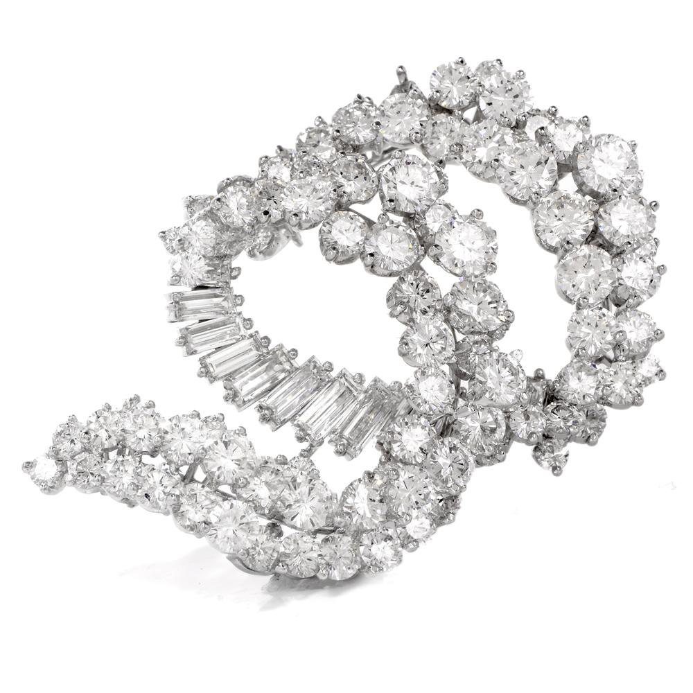 This breathtaking 1960s diamond cluster swirl pin brooch is crafted in solid platinum. Showcasing a swirl design cluster of sparkling extra white round-cut and baguette-cut diamonds approx. 16.70 carats, graded F-G color, and VS1 clarity. Weighing