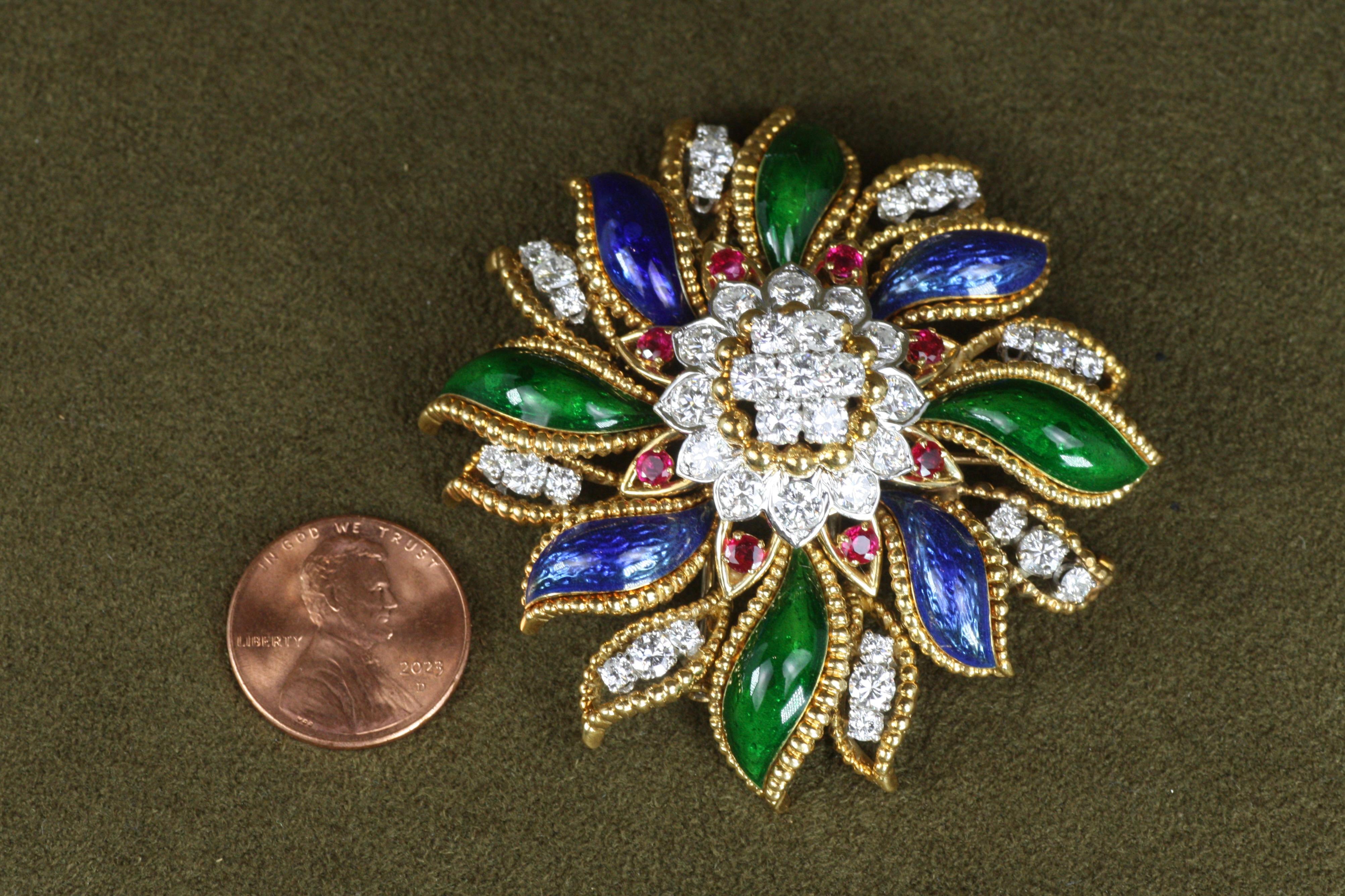 Fabulous floral brooch by David Webb, circa 1960, from the vintage fine jewelry collection at Bracken Jewelers in Santa Monica, California. Crafted in 18K yellow gold and platinum with round brilliant cut diamonds, fine Burmese rubies and blue and
