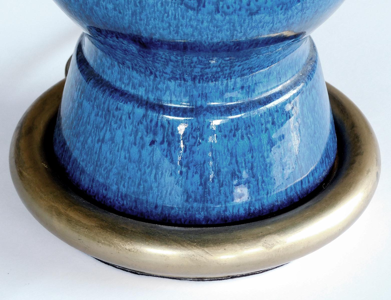 with waisted brass collar above a double-baluster ceramic body all in a richly-colored sapphire-blue drip glaze.