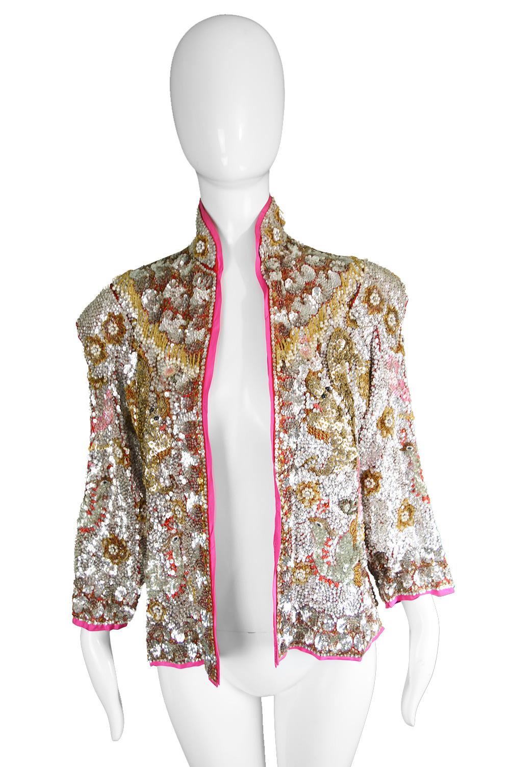 A vintage 'Dragon & Phoenix' nehru jacket heavily hand Beaded with silver sequins from the 1960s. 

Click 'Continue Reading' below to see size & description. 

Estimated Size: UK 10-12/ US 6-8/ EU 38-40. Please check measurements
Bust - 36” /