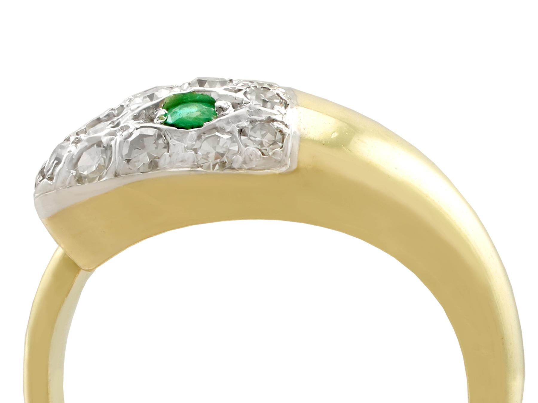 An impressive vintage 1960s 0.10 carat emerald and 0.40 carat diamond, 18 karat yellow and white gold 'snake' ring; part of our diverse emerald jewelry and estate jewelry collections

This fine and impressive vintage gold ring has been crafted in