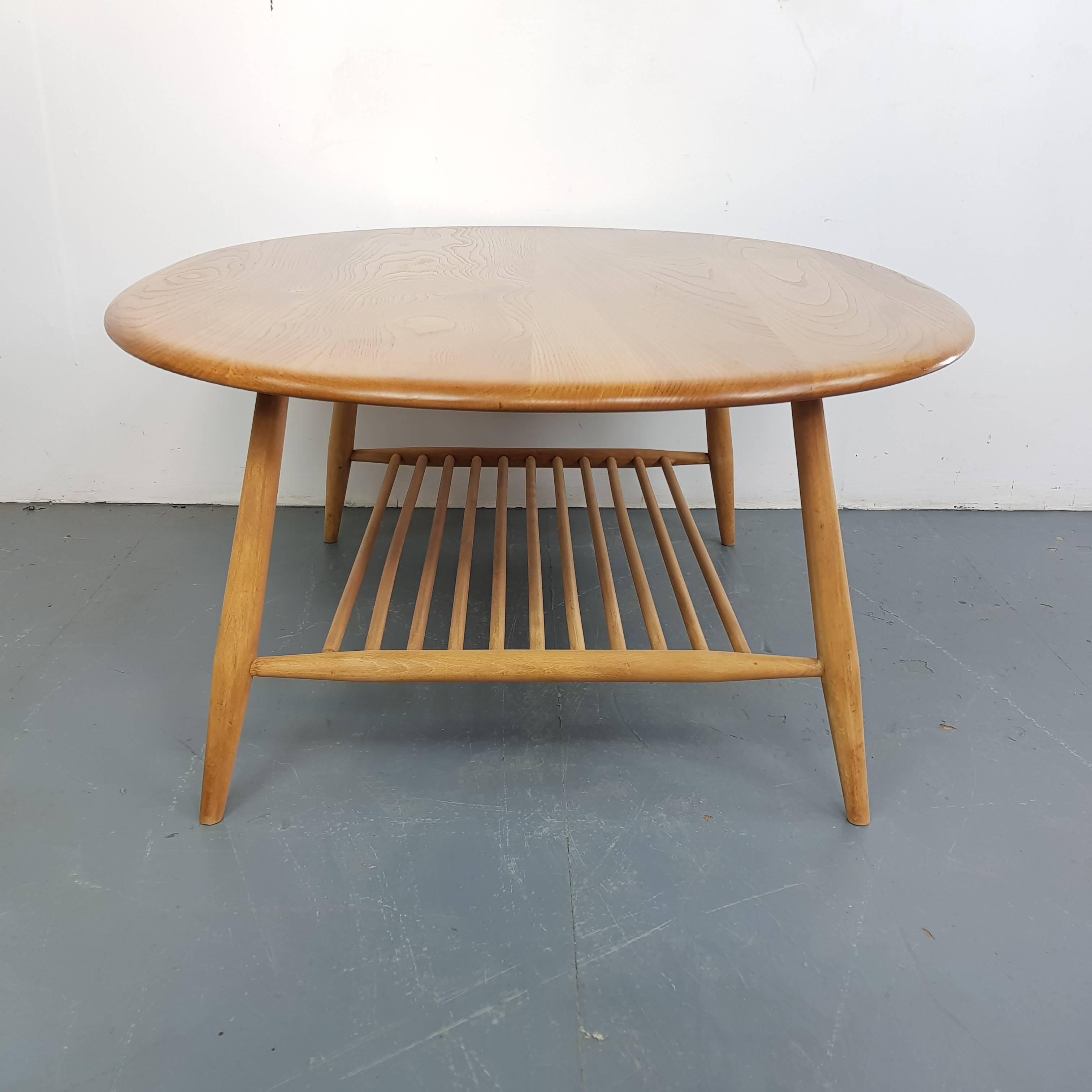 Lovely vintage coffee table designed by Lucian Ercolani, with tapered legs and a magazine shelf underneath. Elm and beech.

In good vintage condition, with some wear commensurate with age and use, but nothing specific to mention.

Approximate